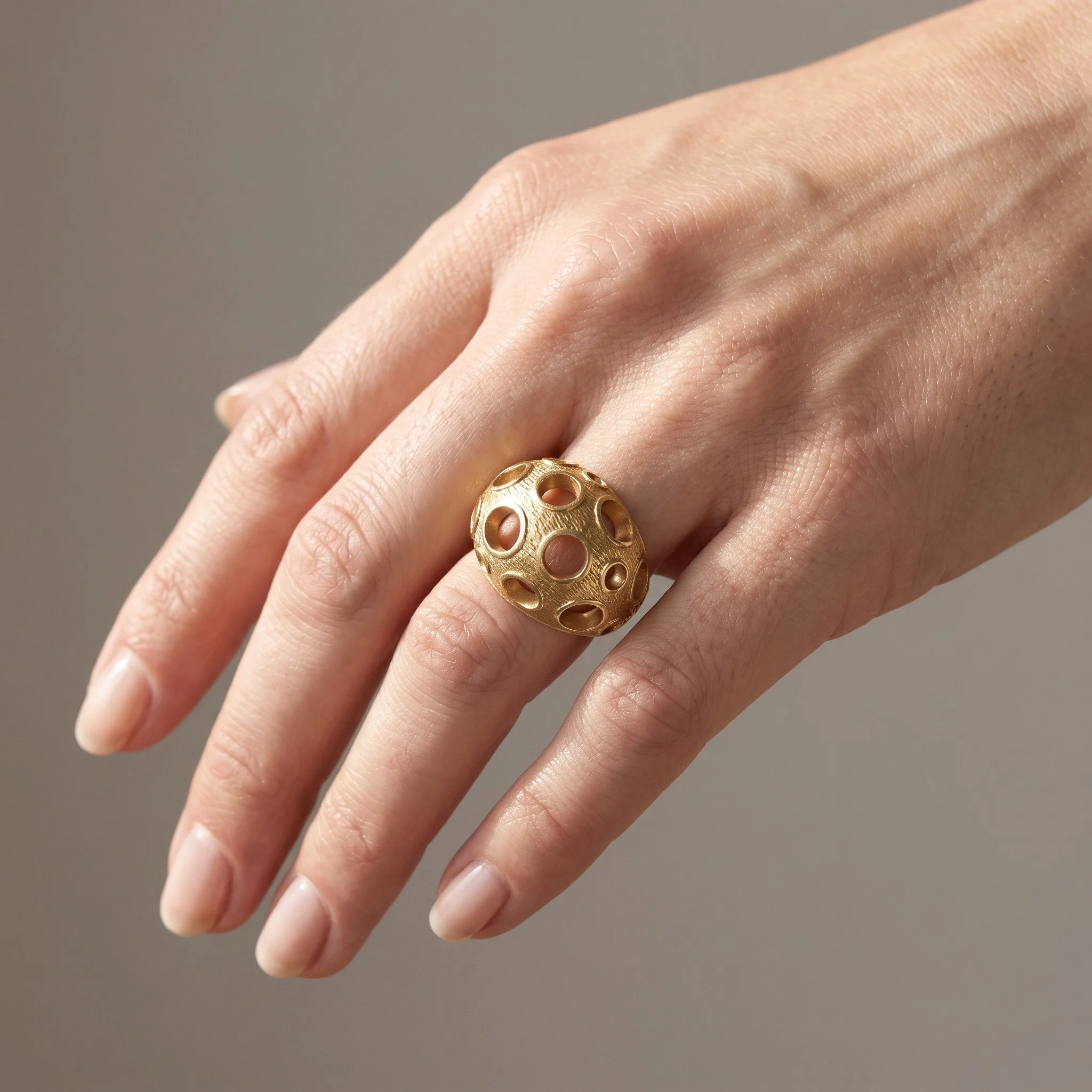 kutchinsky-18kt-gold-openwork-bombe-ring-london-1970s-02-worn-Mozeris-Fine-Antiques.jpg