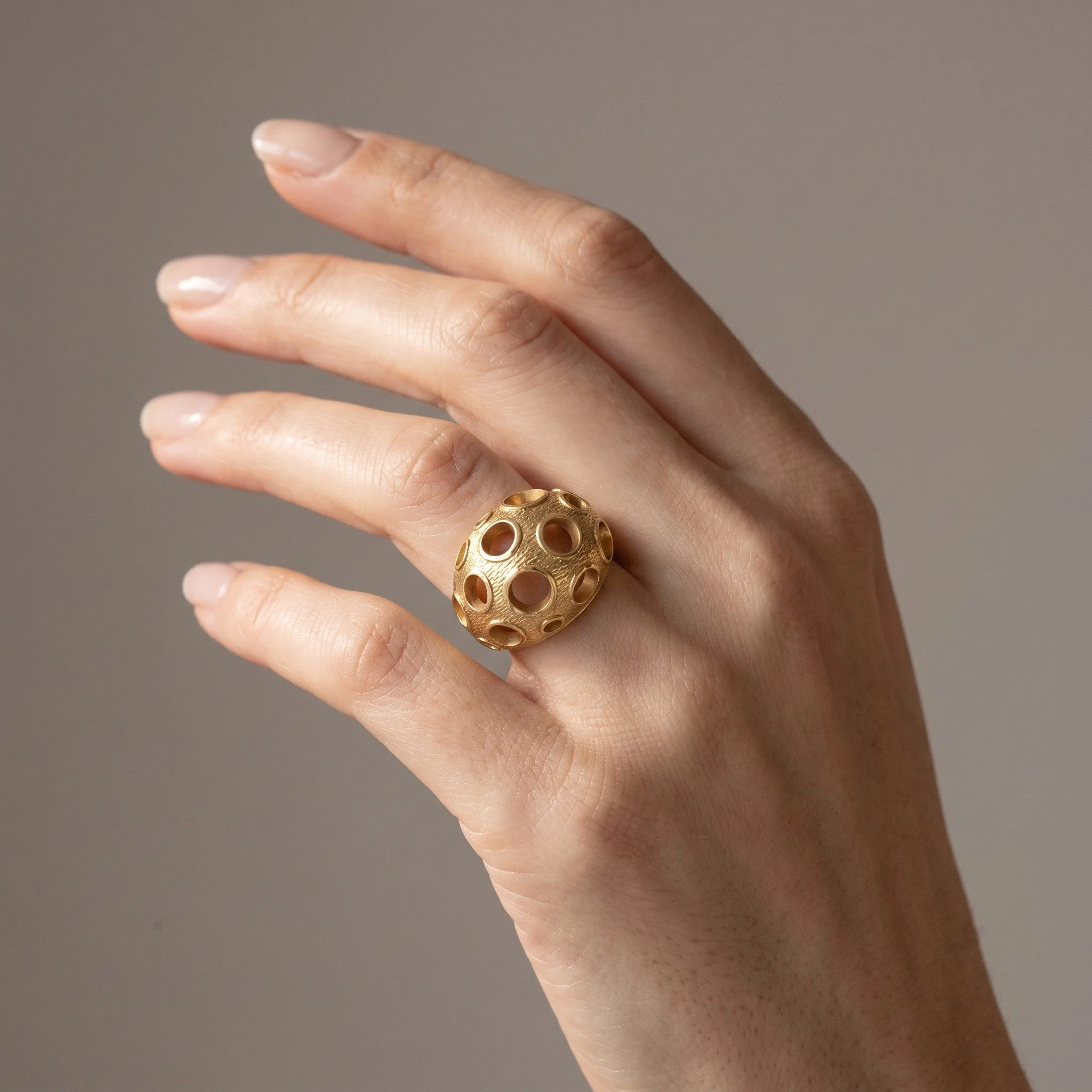 kutchinsky-18kt-gold-openwork-bombe-ring-london-1970s-03-worn-Mozeris-Fine-Antiques.jpg