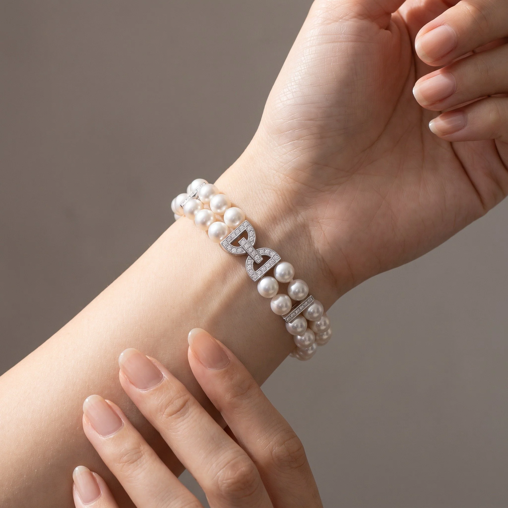 mikimoto-double-strand-cultured-pearl-diamond-bracelet-18kt-white-gold-02-worn-Mozeris-Fine-Antiques.jpg