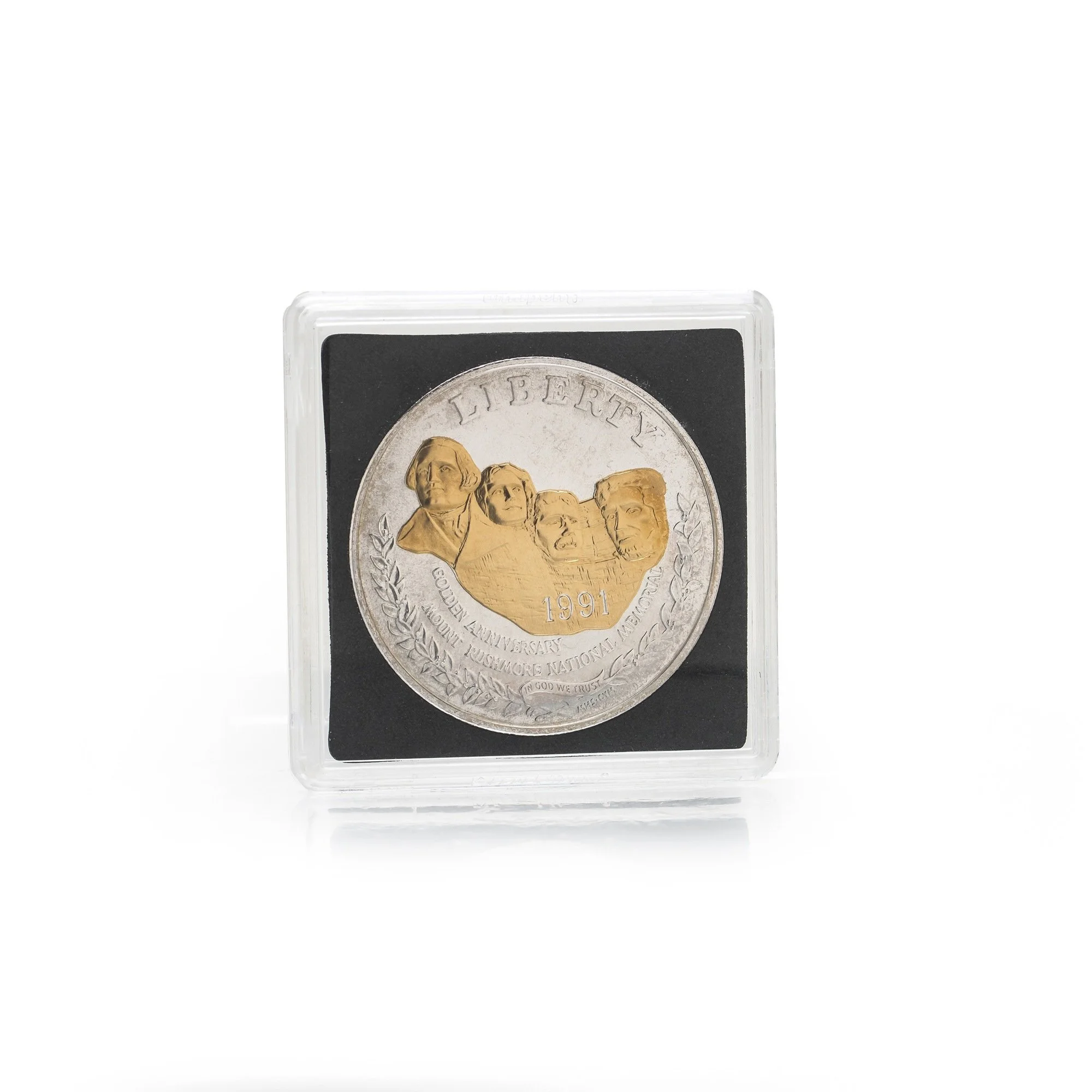 mount-rushmore-1991-gold-highlighted-silver-dollar-04-obverse-in-capsule-Mozeris-Fine-Antiques.jpg