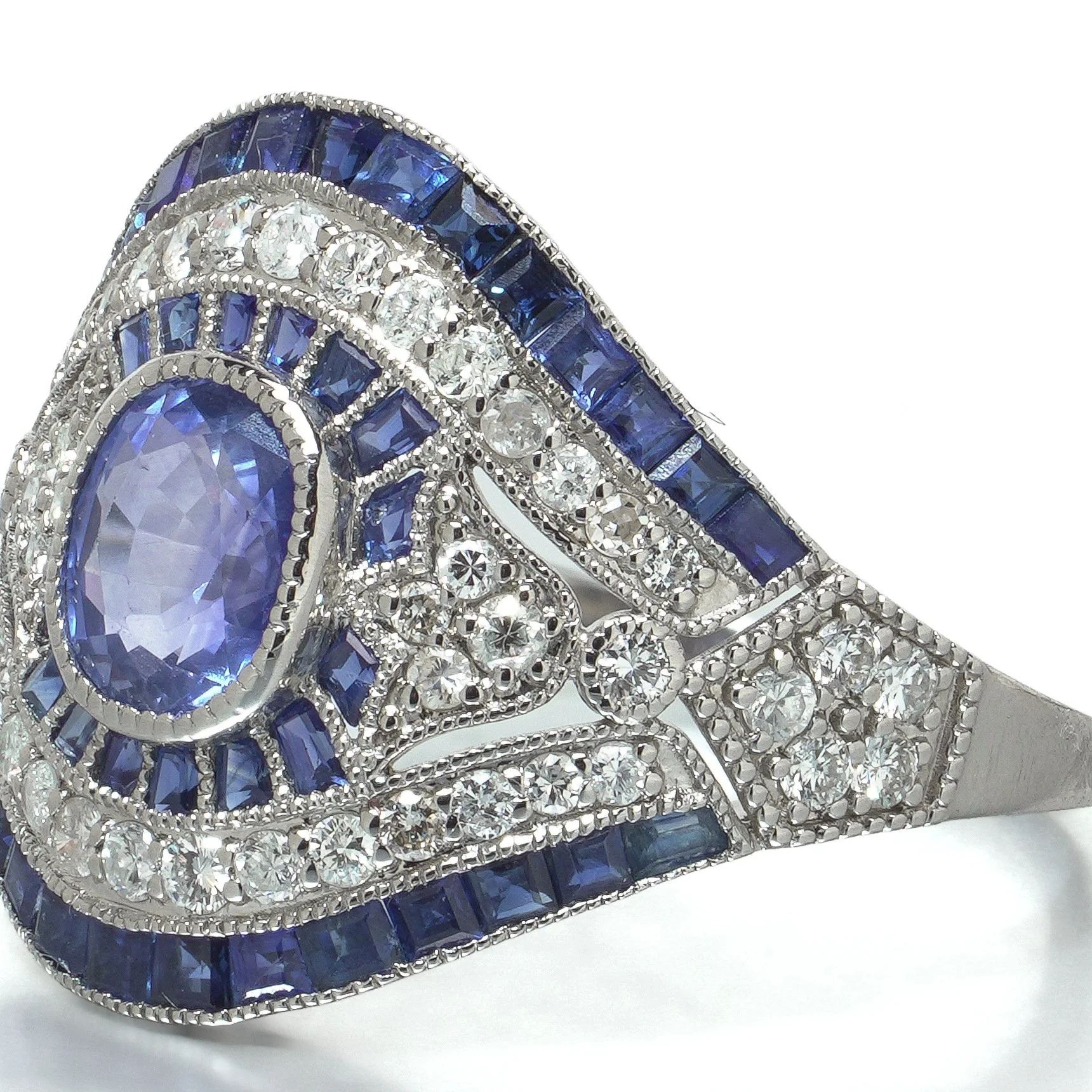 art-deco-style-platinum-109ct-sapphire-and-diamond-bombe-navette-ring-07-angle-Mozeris-Fine-Antiques.jpg
