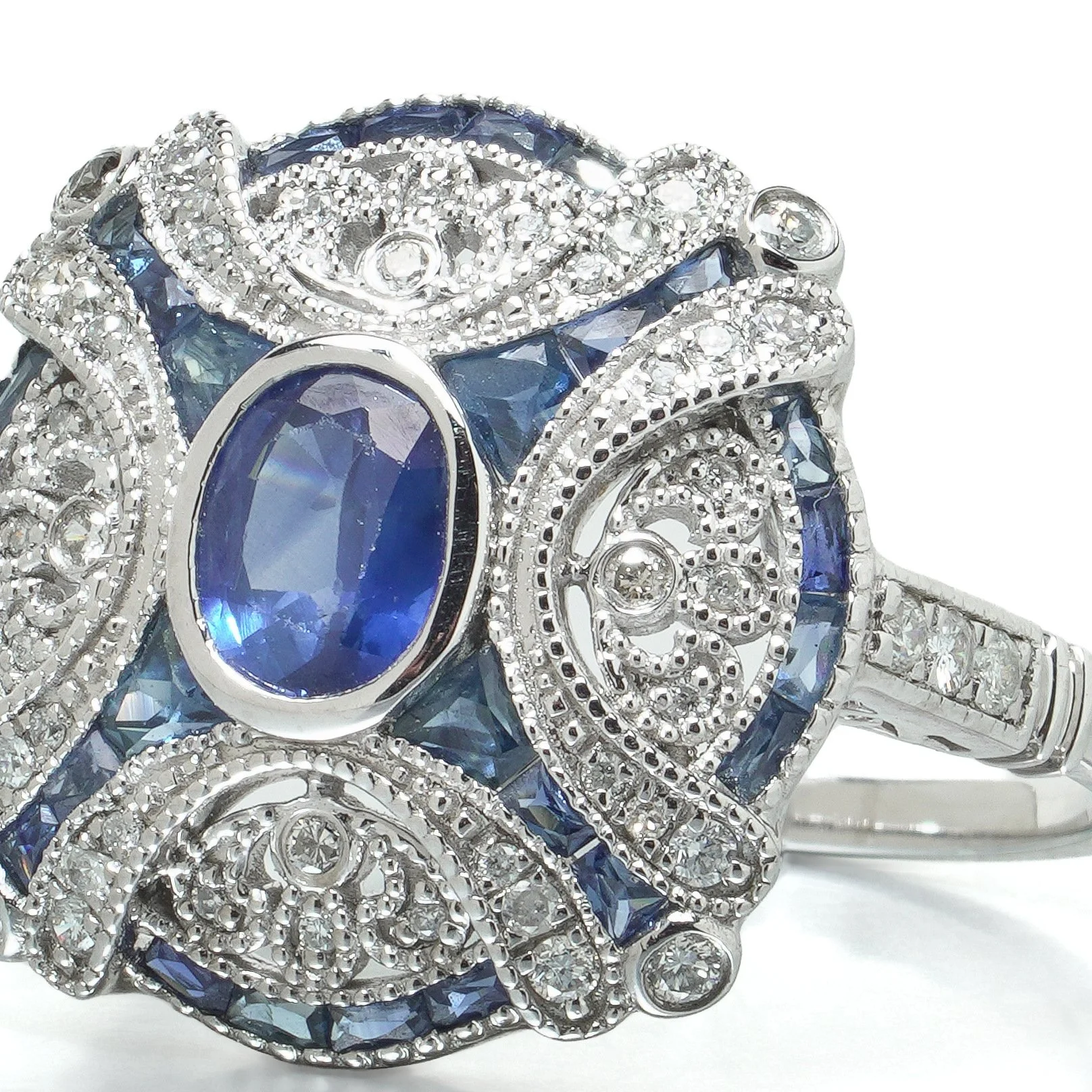 art-deco-style-platinum-sapphire-and-diamond-domed-bombe-ring-07-angle-Mozeris-Fine-Antiques.jpg