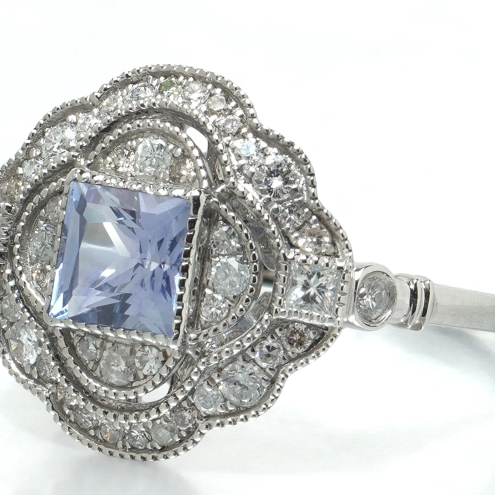 art-deco-style-platinum-square-cut-sapphire-and-diamond-quatrefoil-ring-07-angle-Mozeris-Fine-Antiques.jpg