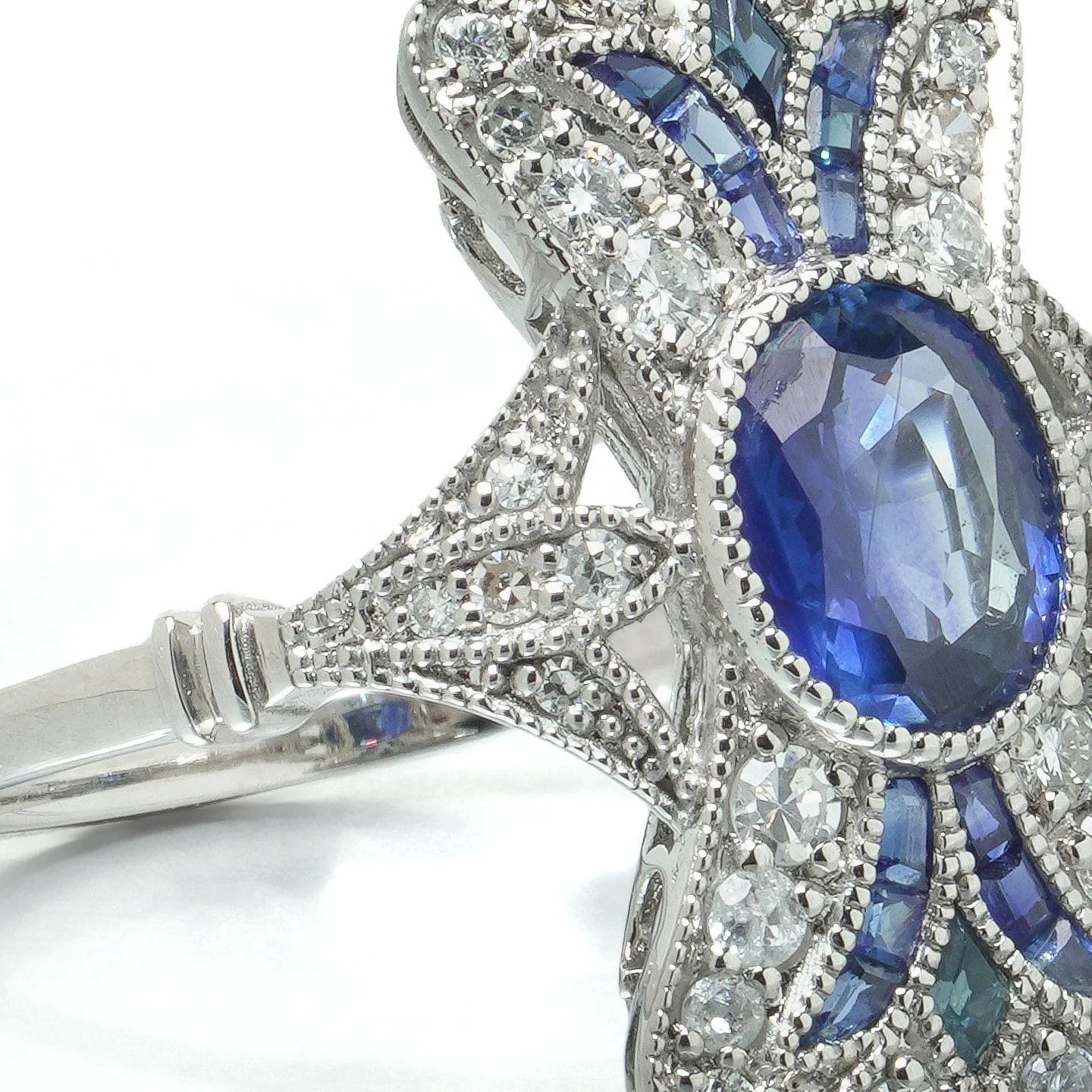 art-deco-style-platinum-111ct-sapphire-and-diamond-bow-plaque-ring-07-centre-Mozeris-Fine-Antiques.jpg