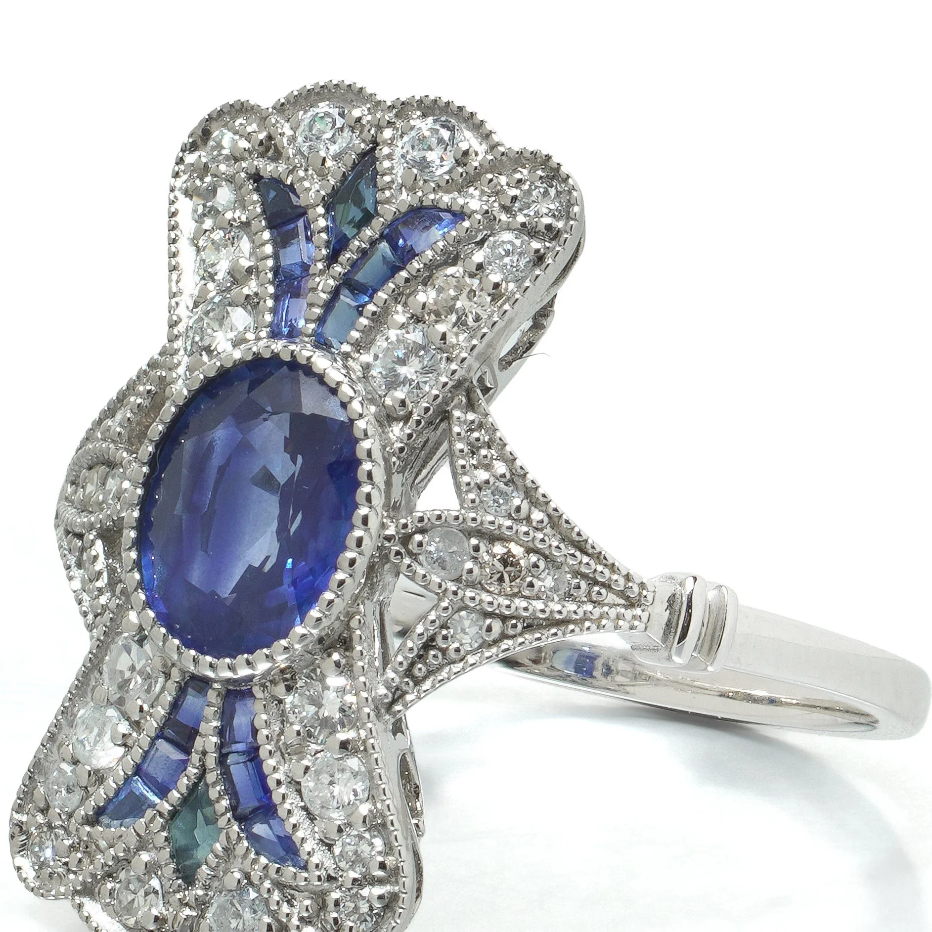 art-deco-style-platinum-111ct-sapphire-and-diamond-bow-plaque-ring-08-angle-Mozeris-Fine-Antiques.jpg