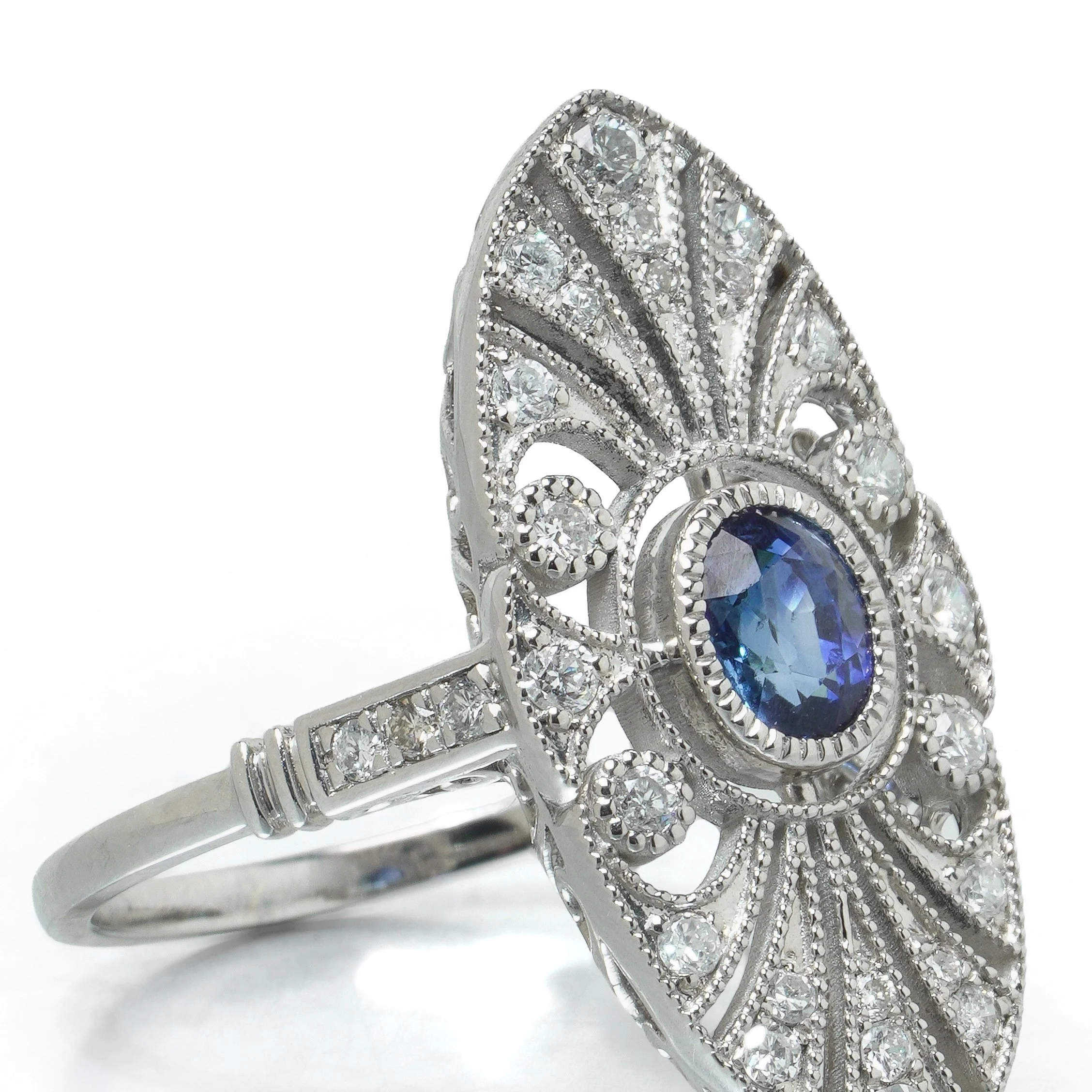 art-deco-style-platinum-sapphire-and-diamond-pierced-navette-ring-06-angle-Mozeris-Fine-Antiques.jpg