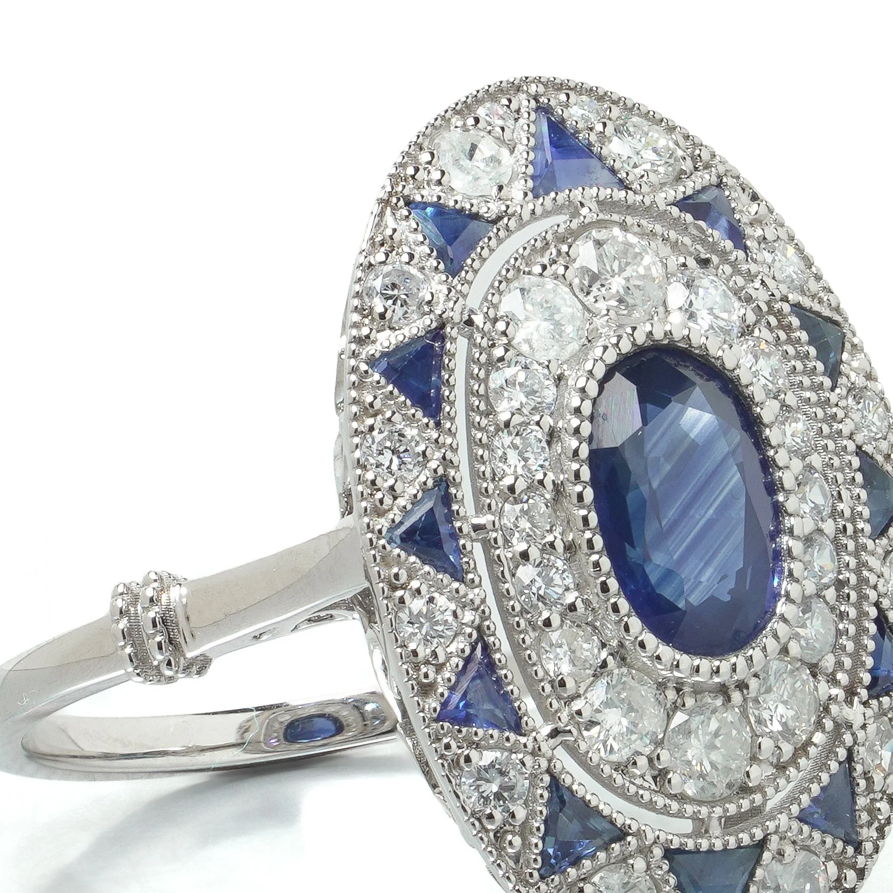 art-deco-style-platinum-113ct-sapphire-and-diamond-oval-plaque-ring-07-angle-Mozeris-Fine-Antiques.jpg
