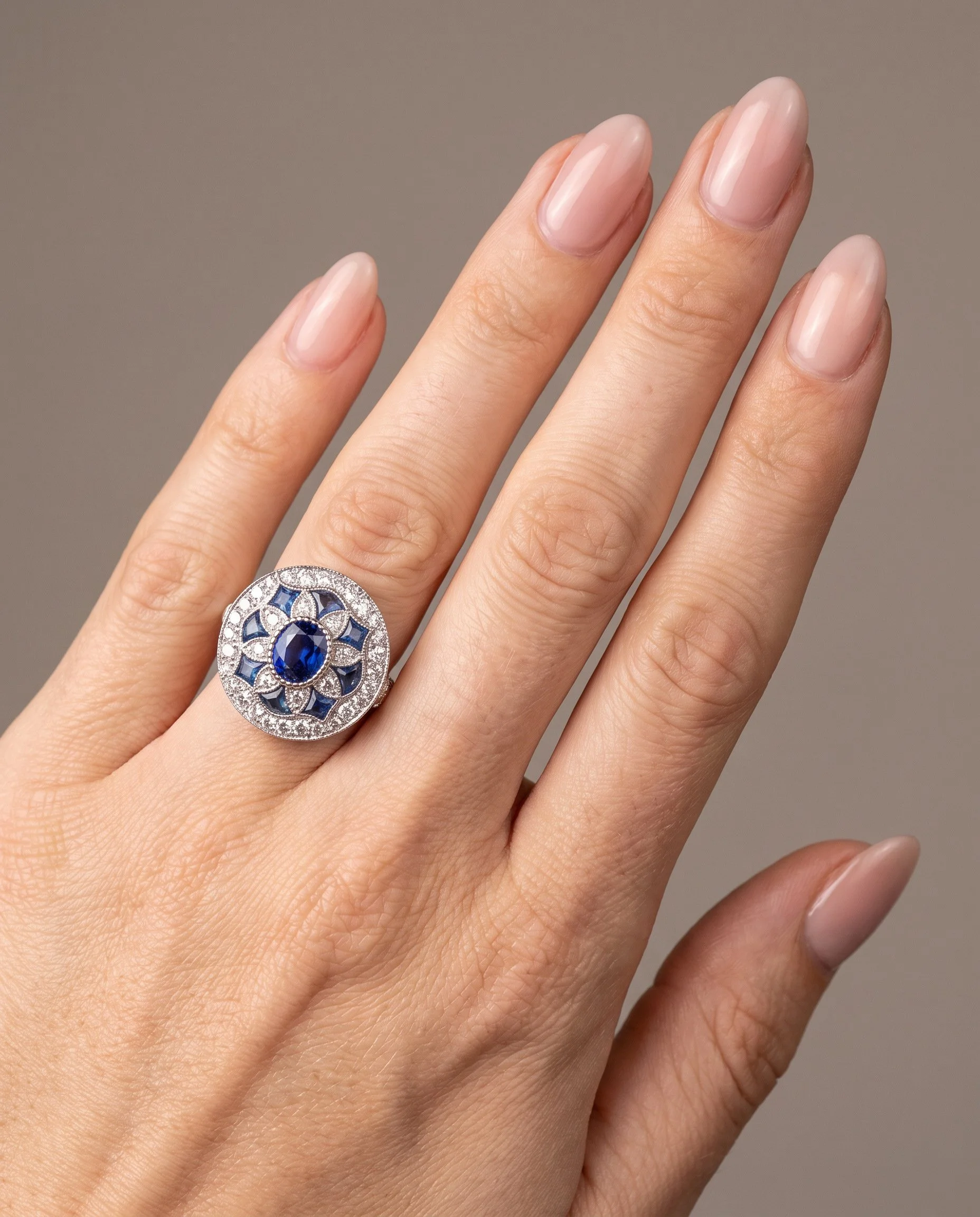 art-deco-style-platinum-sapphire-and-diamond-flowerhead-target-ring-worn1-Mozeris-Fine-Antiques.jpg