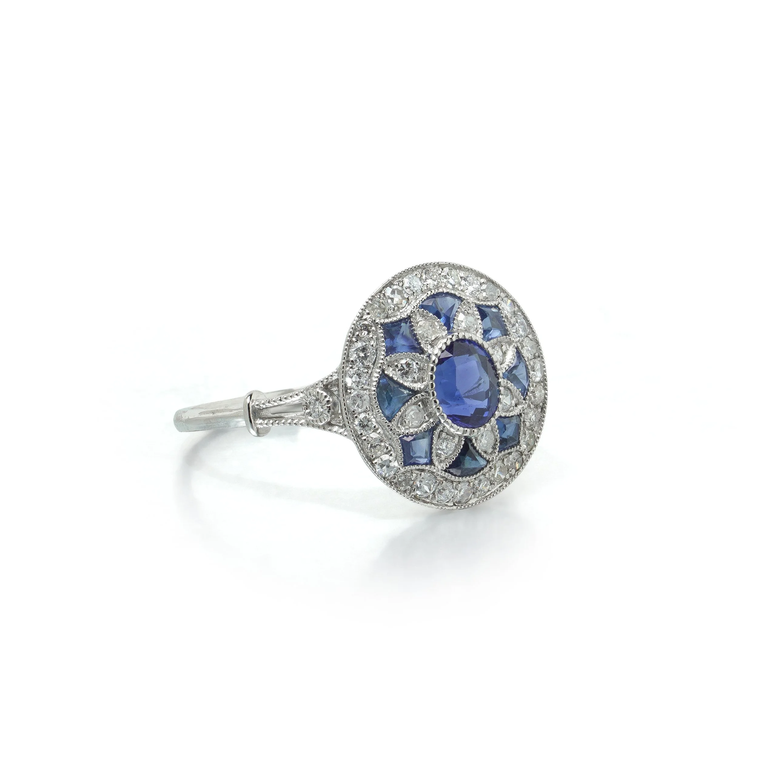 art-deco-style-platinum-sapphire-and-diamond-flowerhead-target-ring-03-view3-Mozeris-Fine-Antiques.jpg