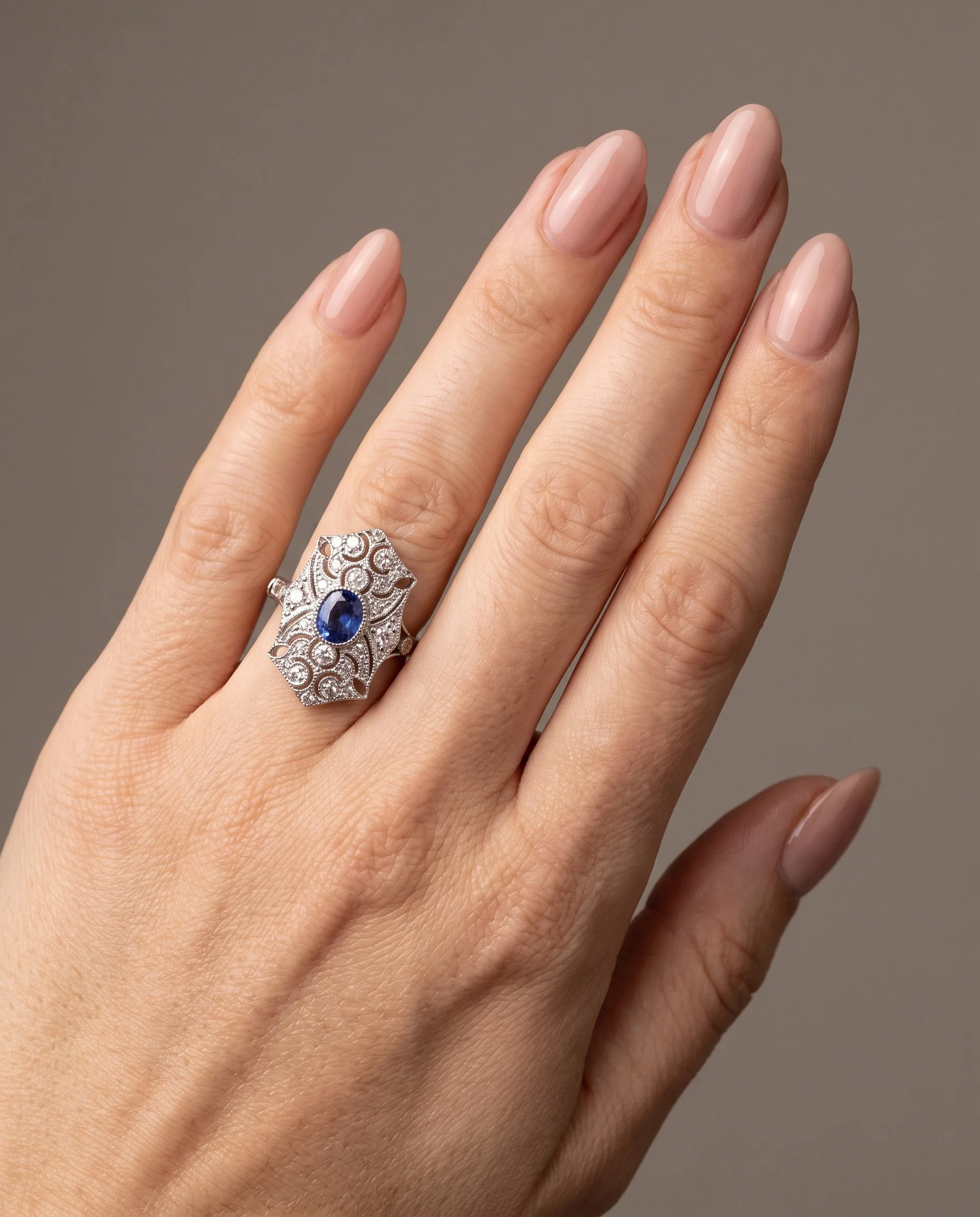 art-deco-style-platinum-sapphire-and-diamond-pierced-shield-ring-worn1-Mozeris-Fine-Antiques.jpg