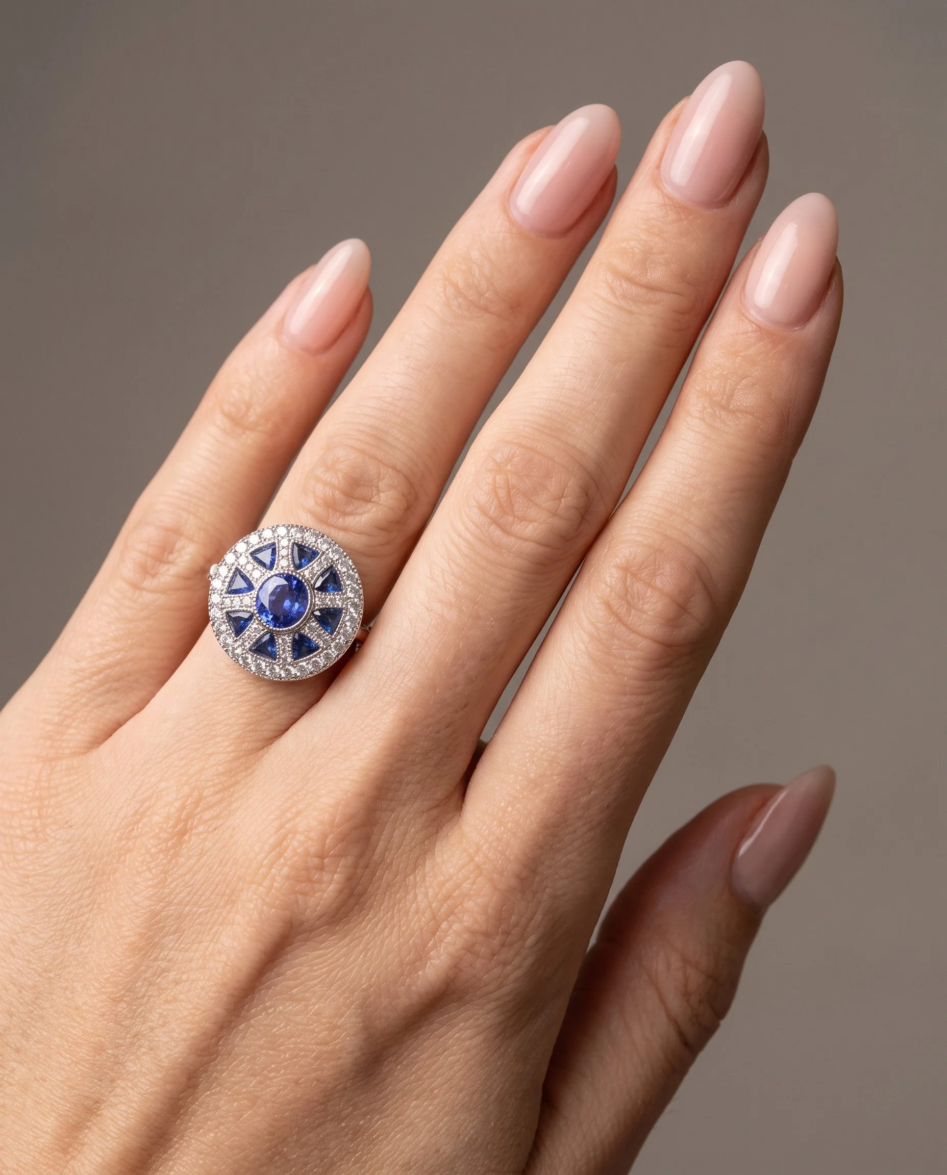art-deco-style-platinum-sapphire-and-diamond-wheel-target-ring-worn1-Mozeris-Fine-Antiques.jpg