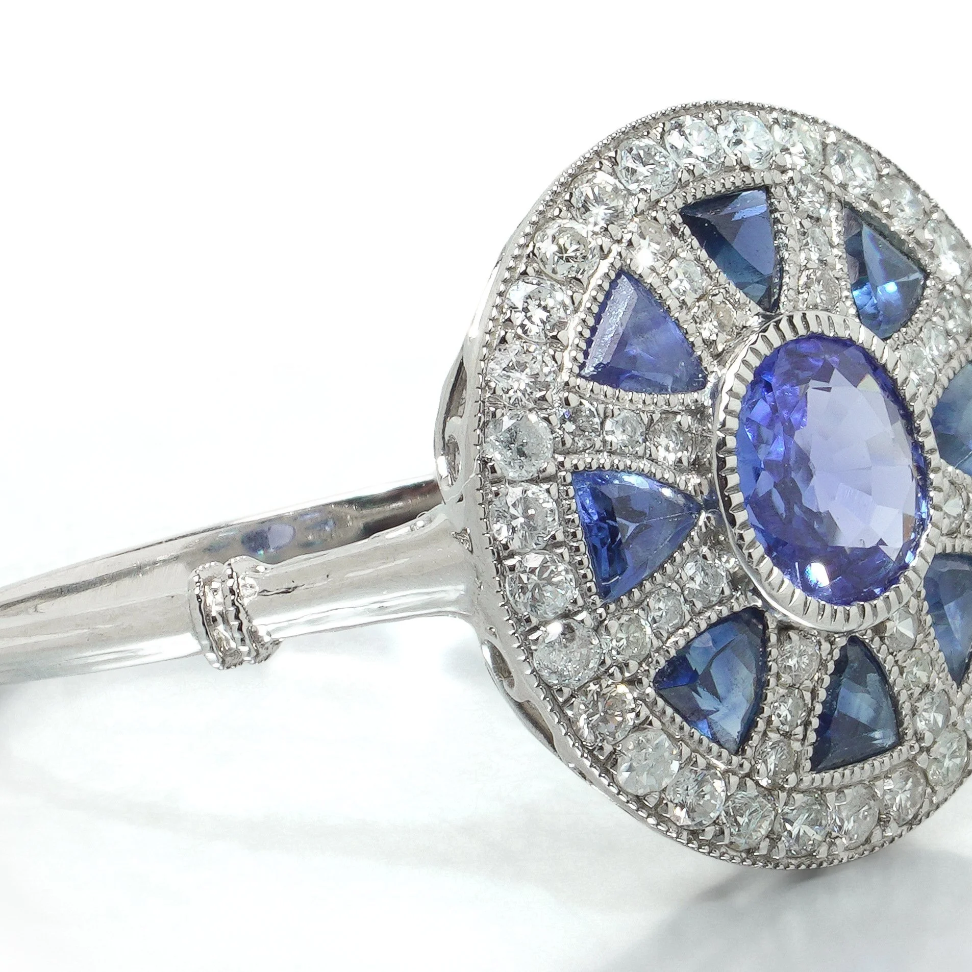 art-deco-style-platinum-sapphire-and-diamond-wheel-target-ring-07-angle-Mozeris-Fine-Antiques.jpg