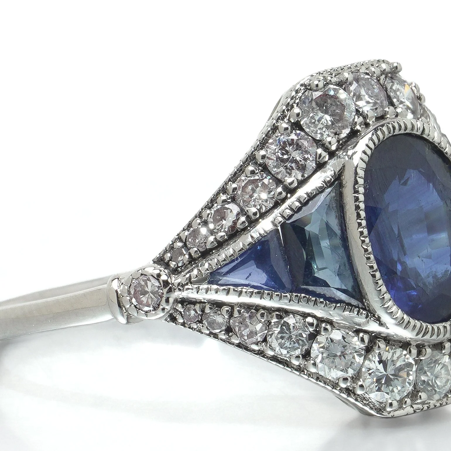 art-deco-style-platinum-145ct-sapphire-and-diamond-navette-ring-07-angle-Mozeris-Fine-Antiques.jpg
