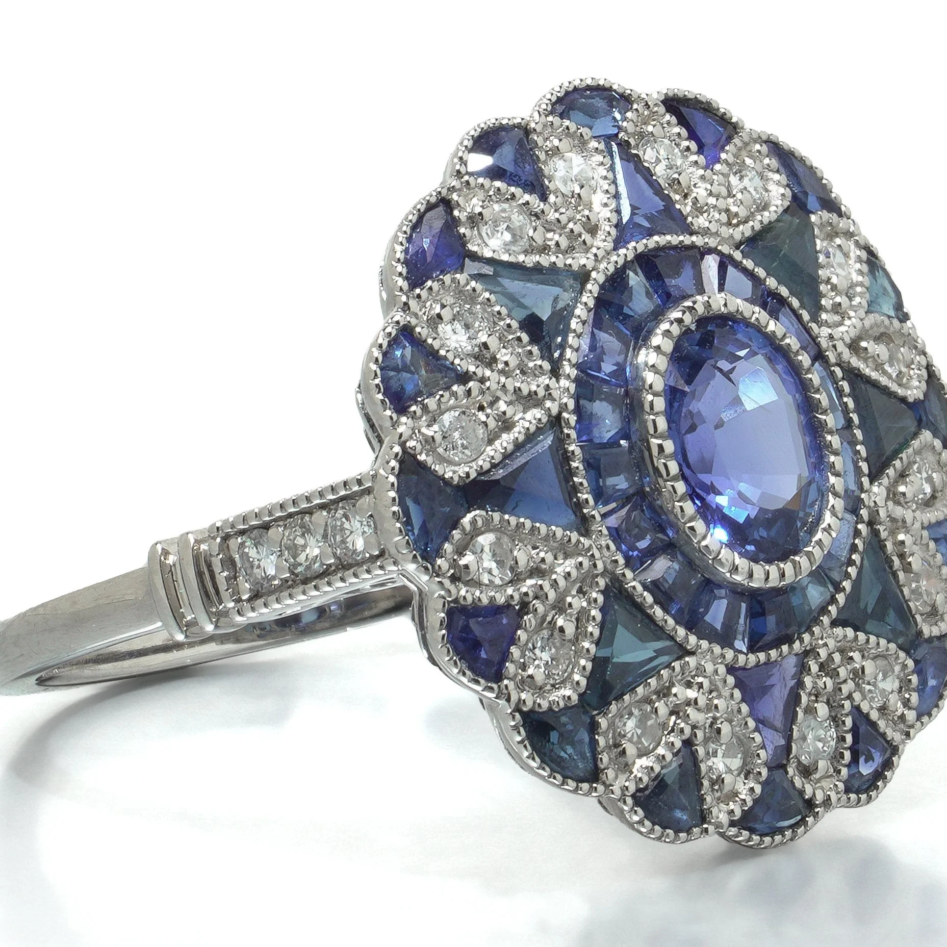 art-deco-style-platinum-sapphire-and-diamond-scalloped-cluster-ring-07-angle-Mozeris-Fine-Antiques.jpg