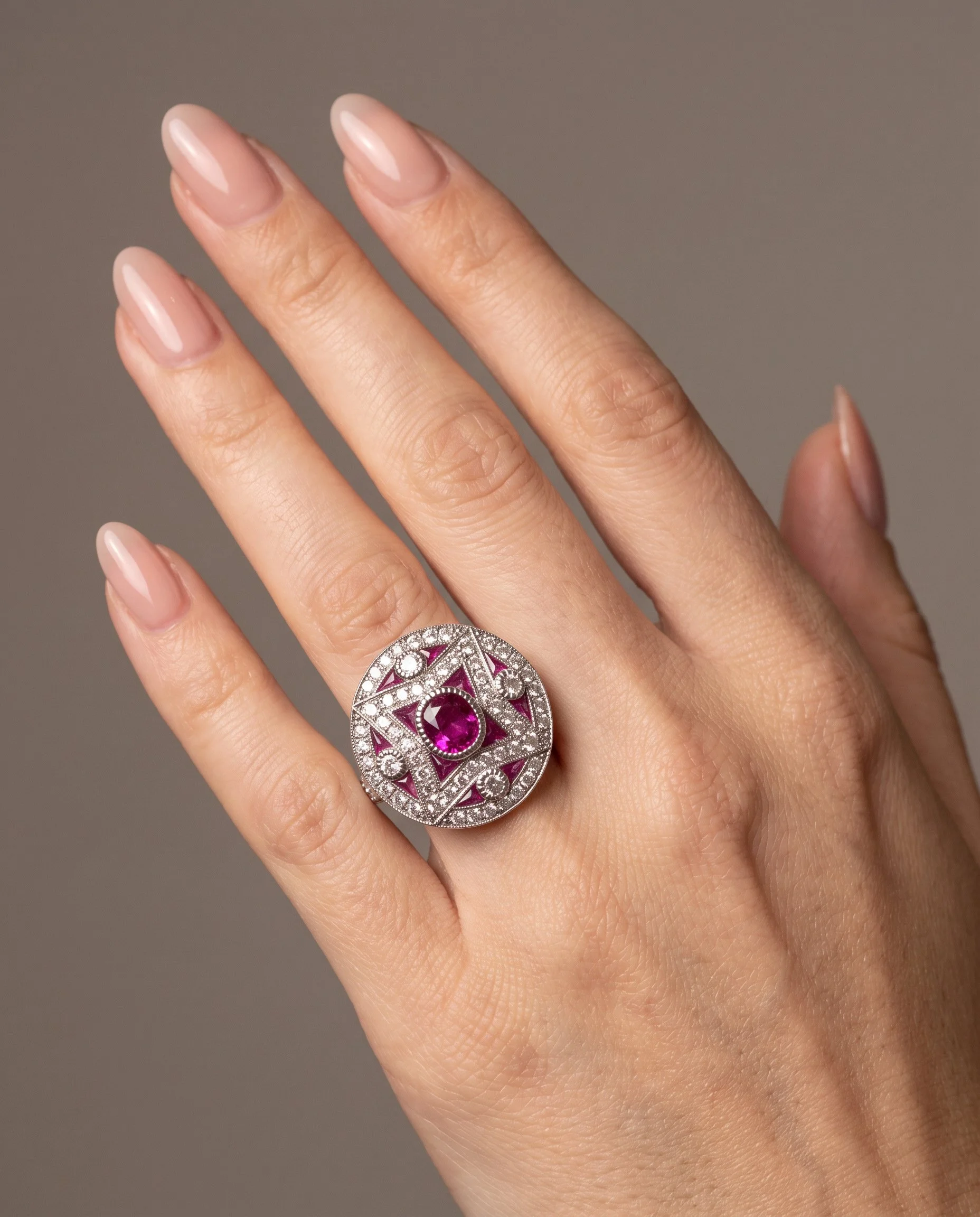 art-deco-style-platinum-mozambique-ruby-and-diamond-star-target-ring-worn1-Mozeris-Fine-Antiques.jpg