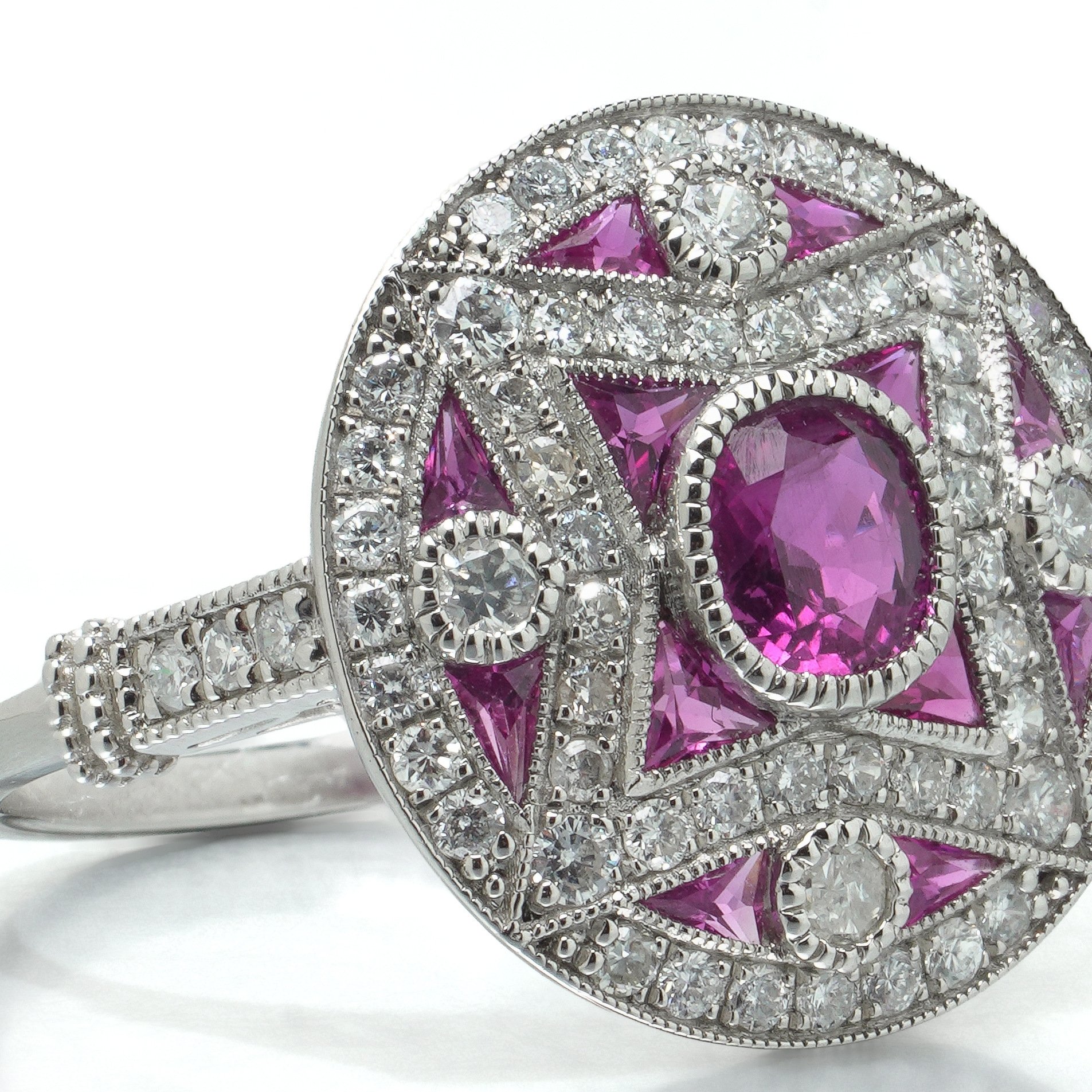 art-deco-style-platinum-mozambique-ruby-and-diamond-star-target-ring-07-angle-Mozeris-Fine-Antiques.jpg