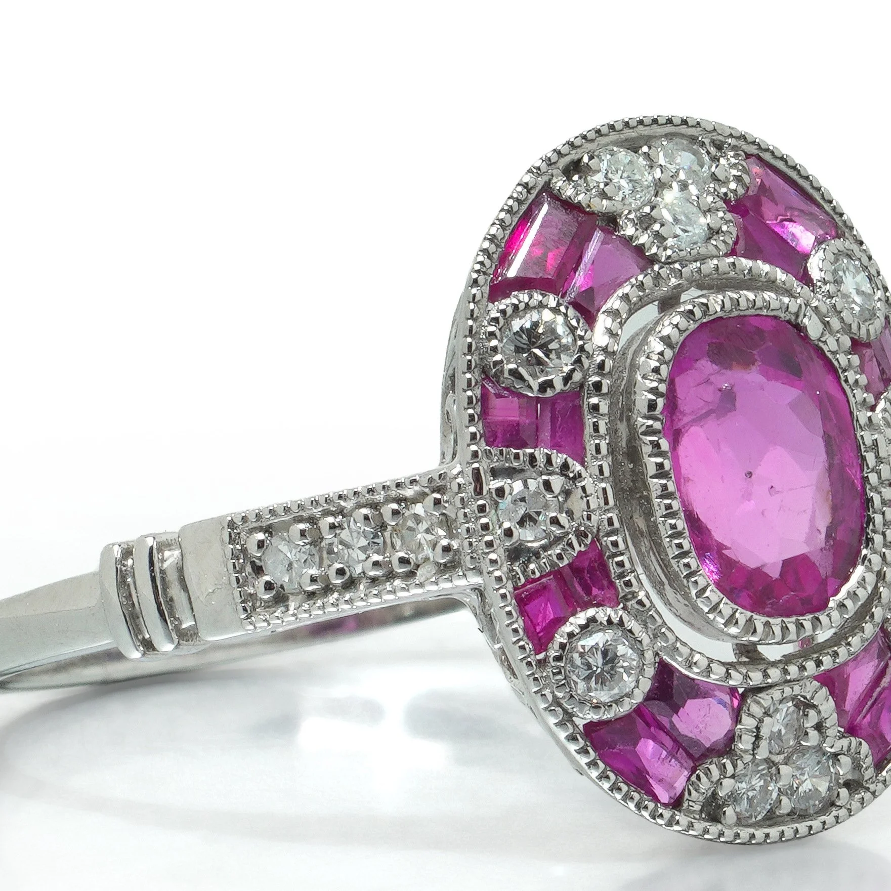 art-deco-style-platinum-081ct-mozambique-ruby-and-diamond-cluster-ring-07-angle-Mozeris-Fine-Antiques.jpg