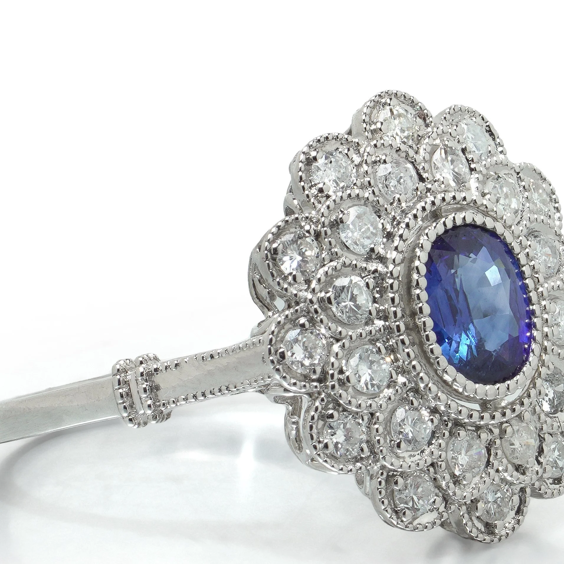 art-deco-style-platinum-ceylon-sapphire-and-diamond-flowerhead-cluster-ring-07-angle-Mozeris-Fine-Antiques.jpg
