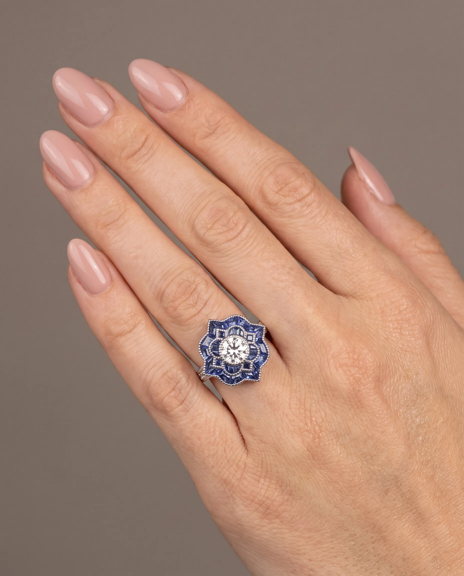 art-deco-style-platinum-diamond-and-calibre-sapphire-star-cluster-ring-worn1-Mozeris-Fine-Antiques.jpg