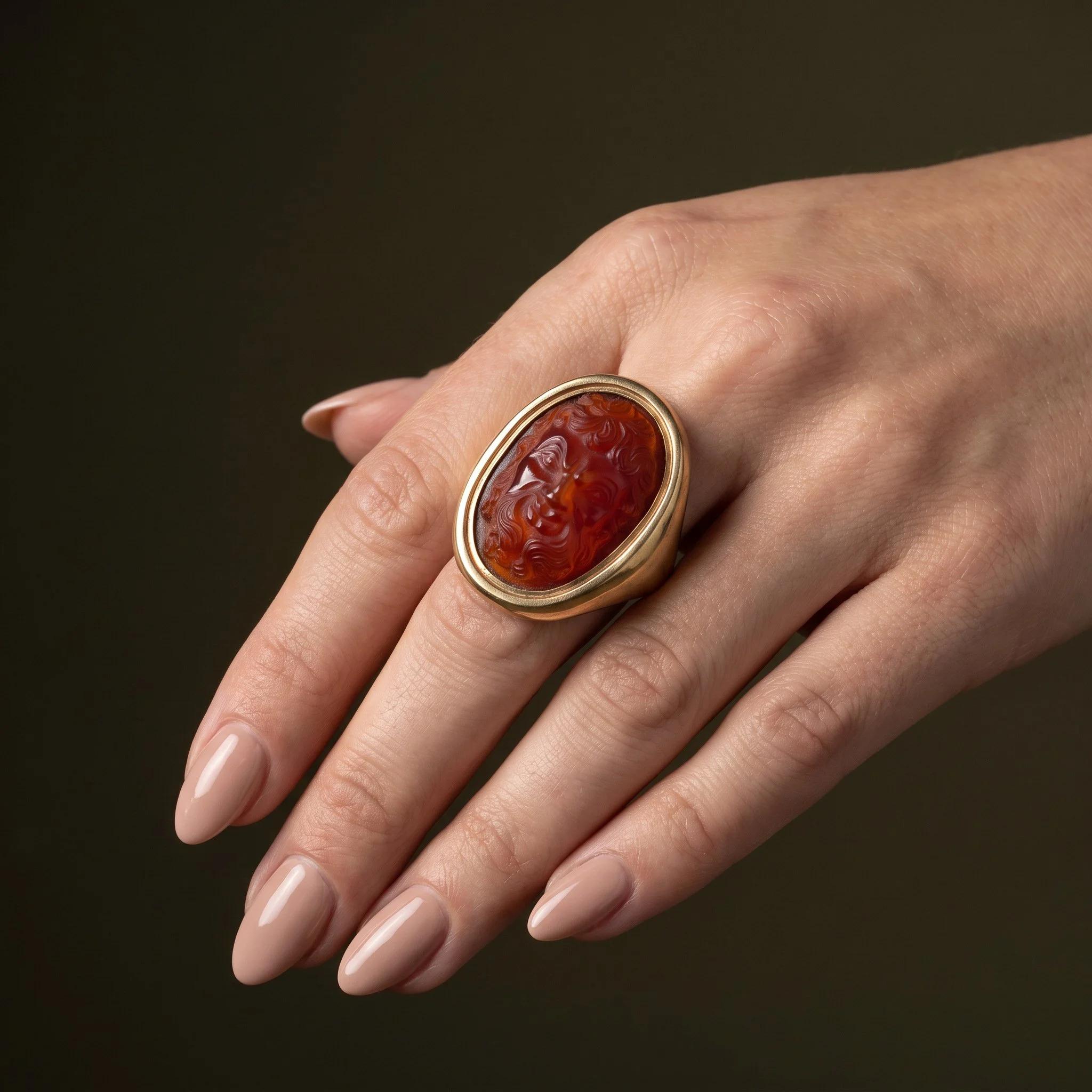 Victorian-Carnelian-Cameo-Ring-Carved-Bacchic-Mask-in-19th-Century-Gold-09-worn-womans-hand.jpg