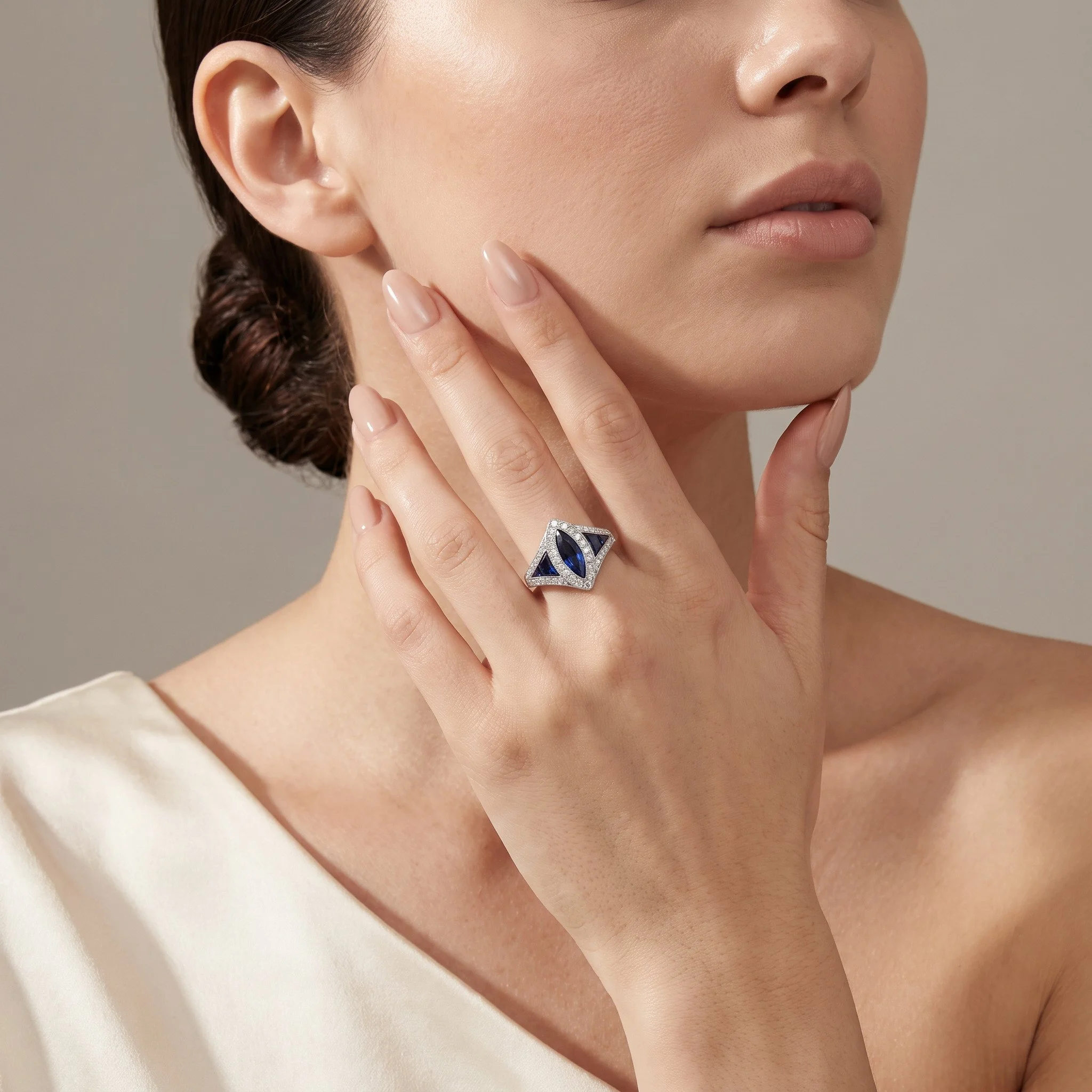 Art Deco platinum marquise sapphire and diamond ring worn on the hand