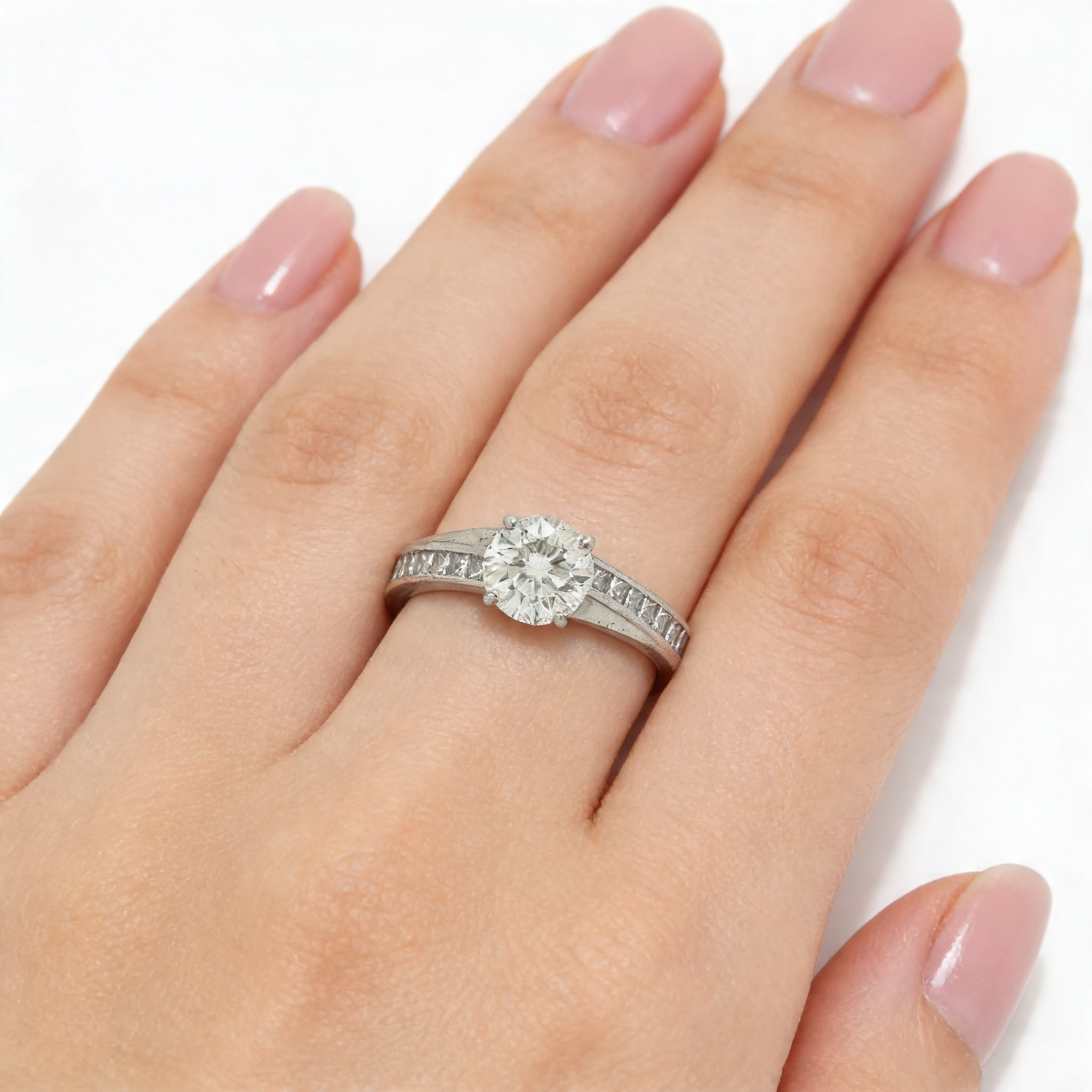 1.6ct diamond solitaire with square diamond shoulders.png