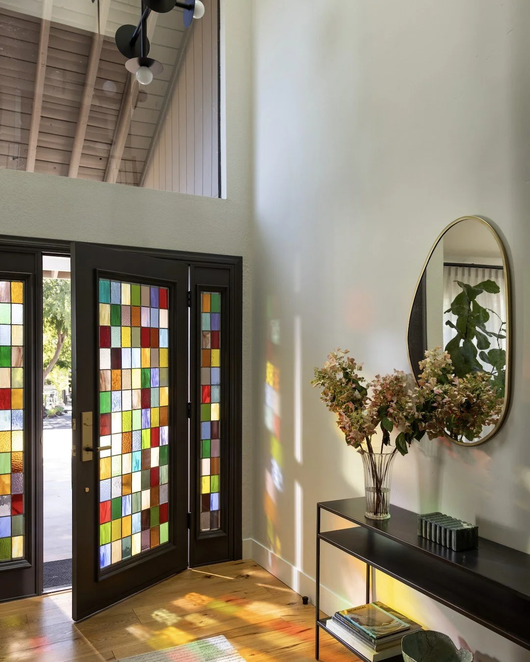 We teamed up with @aradiaglasscraft to bring our client&rsquo;s vision to life. Forty colors merge in a patchwork of light and texture, creating a statement entry for our Funky in Fair Oaks project. 🌈

📸: @stephanie___russo

Stylist: @emilyairoso