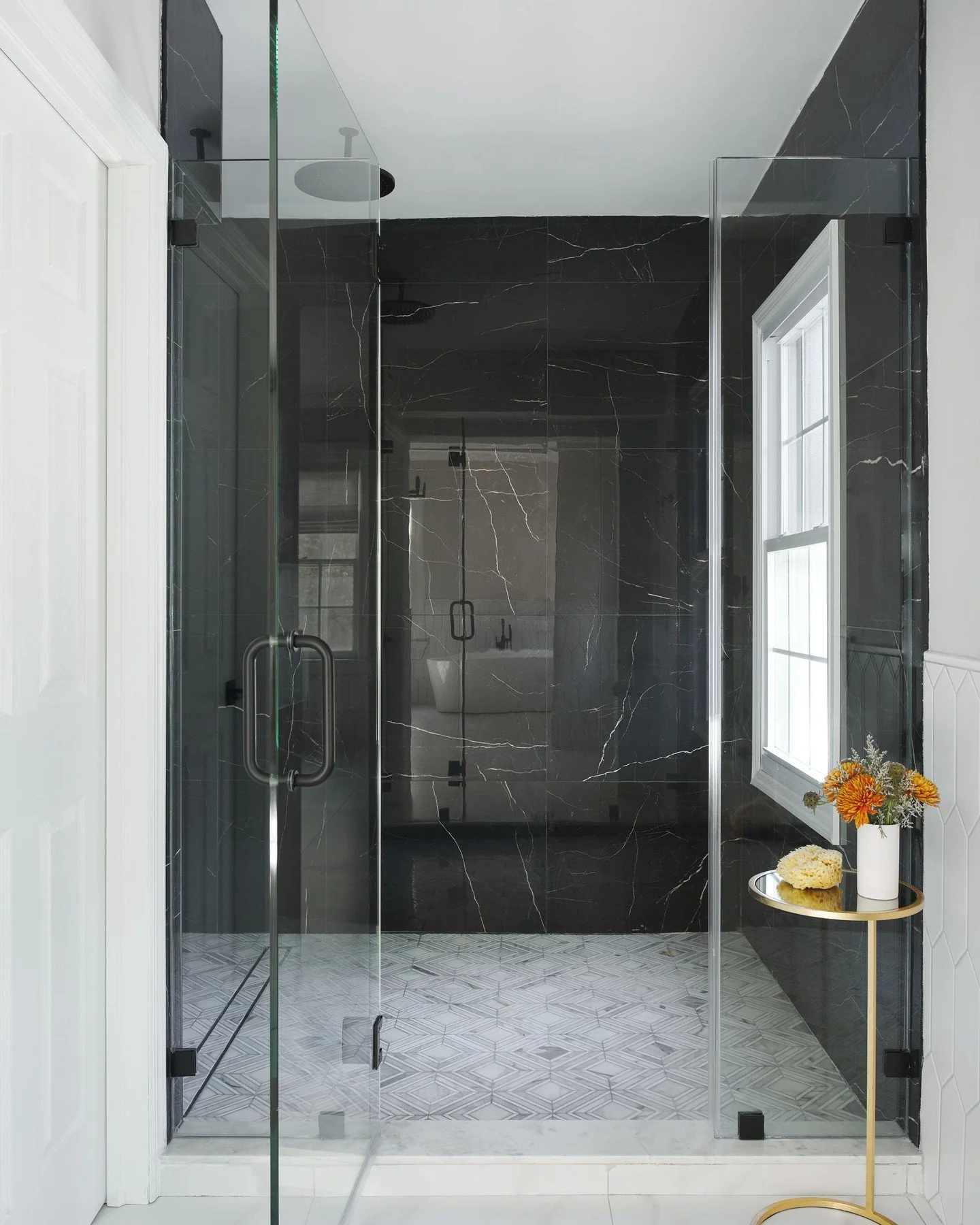 In this 1901 New Jersey home, we transformed part of a bedroom into an expanded shower and wrapped it in marble tile to preserve the historic character while giving it a modern update.

📸: @lisa.russman