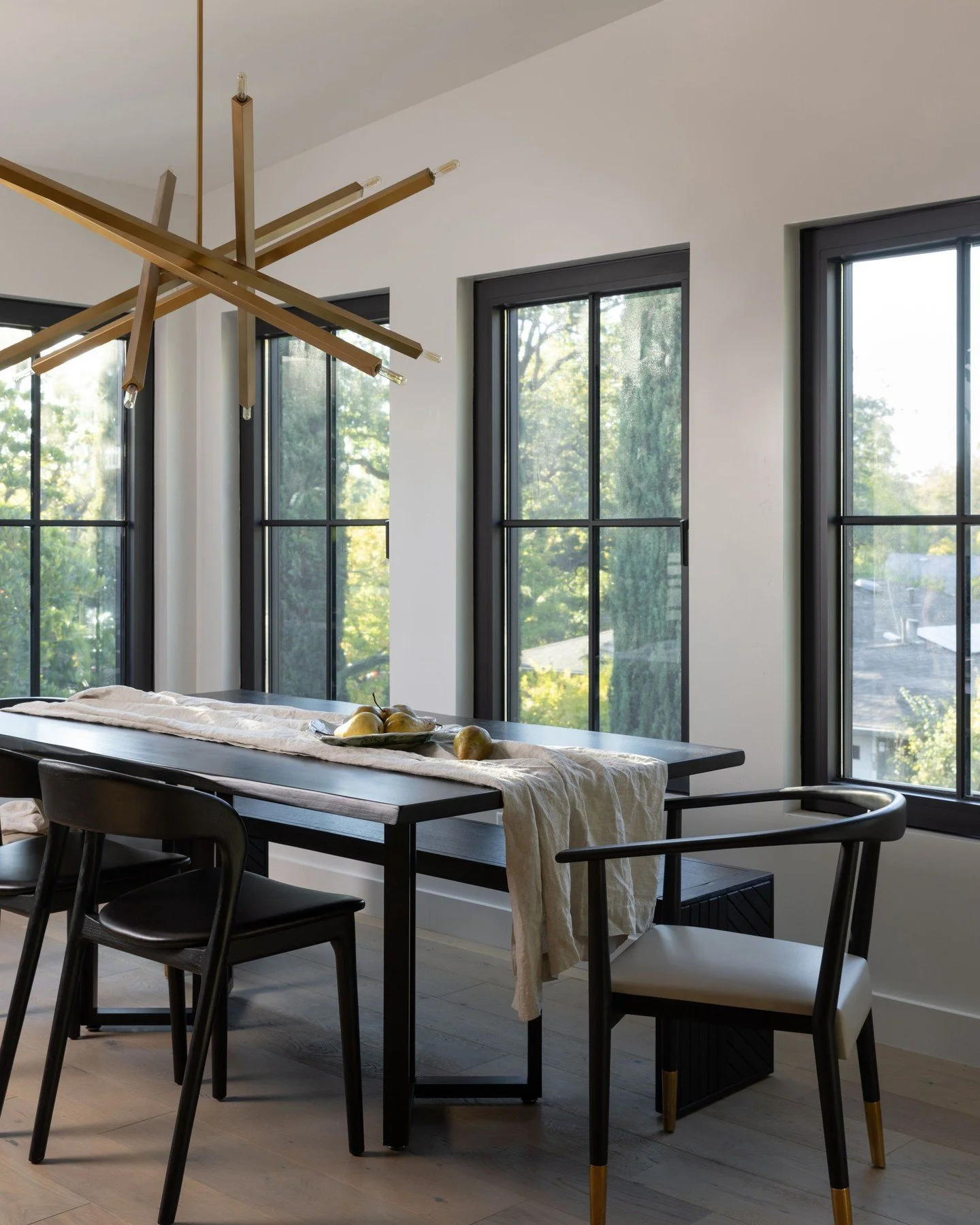 Elevated details keep this dining nook minimal, but far from basic with sculptural lighting, tailored furniture, and a moody palette. 

📸: @nicolediannephoto
Styling by: @whitneyrosefecteau