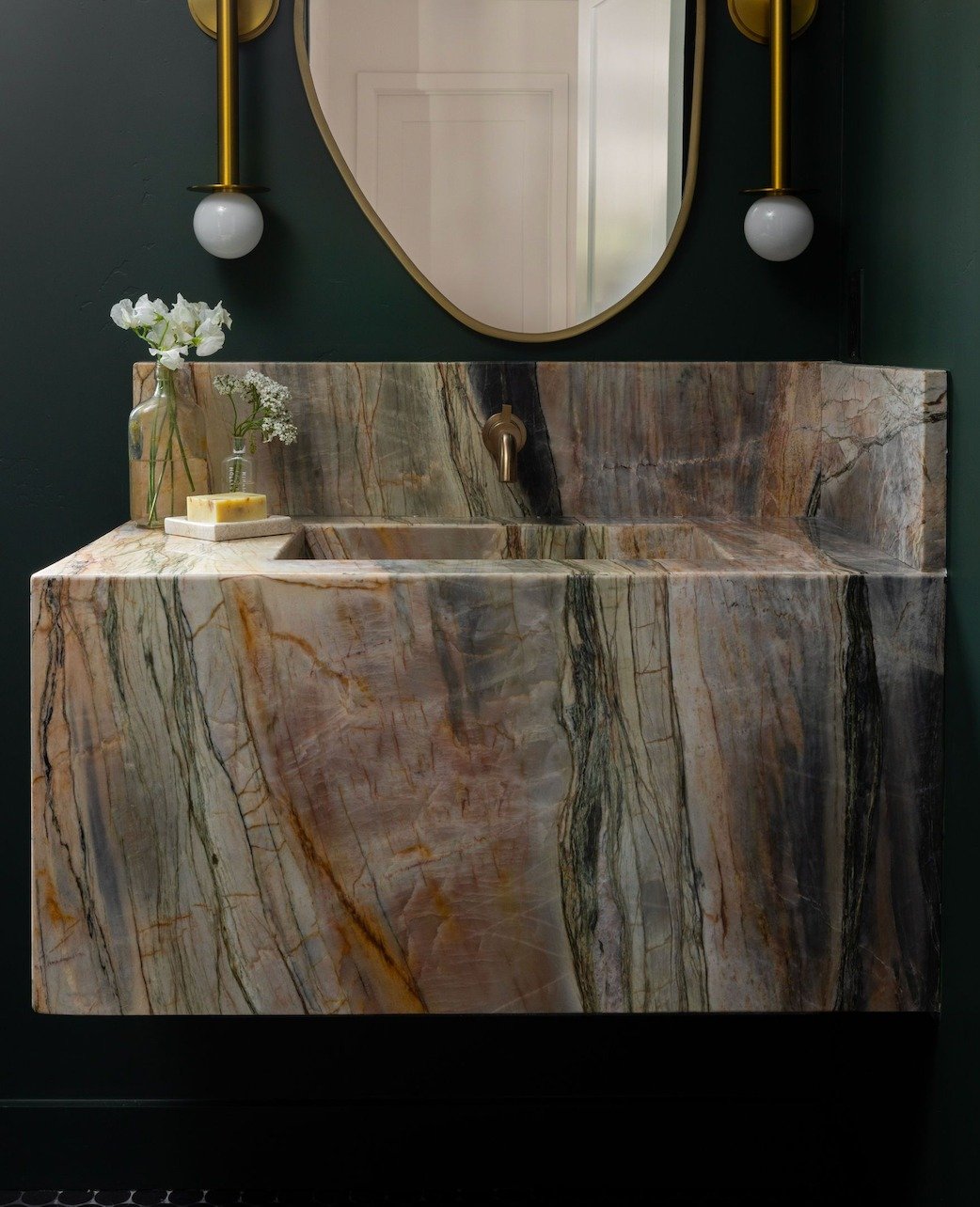 Why do we choose natural stone whenever possible?

Because nature does it better.

This quartzite vanity wasn't designed by a manufacturer, it was formed over millions of years. The veining, colors, and movement are impossible to duplicate. 

Every s
