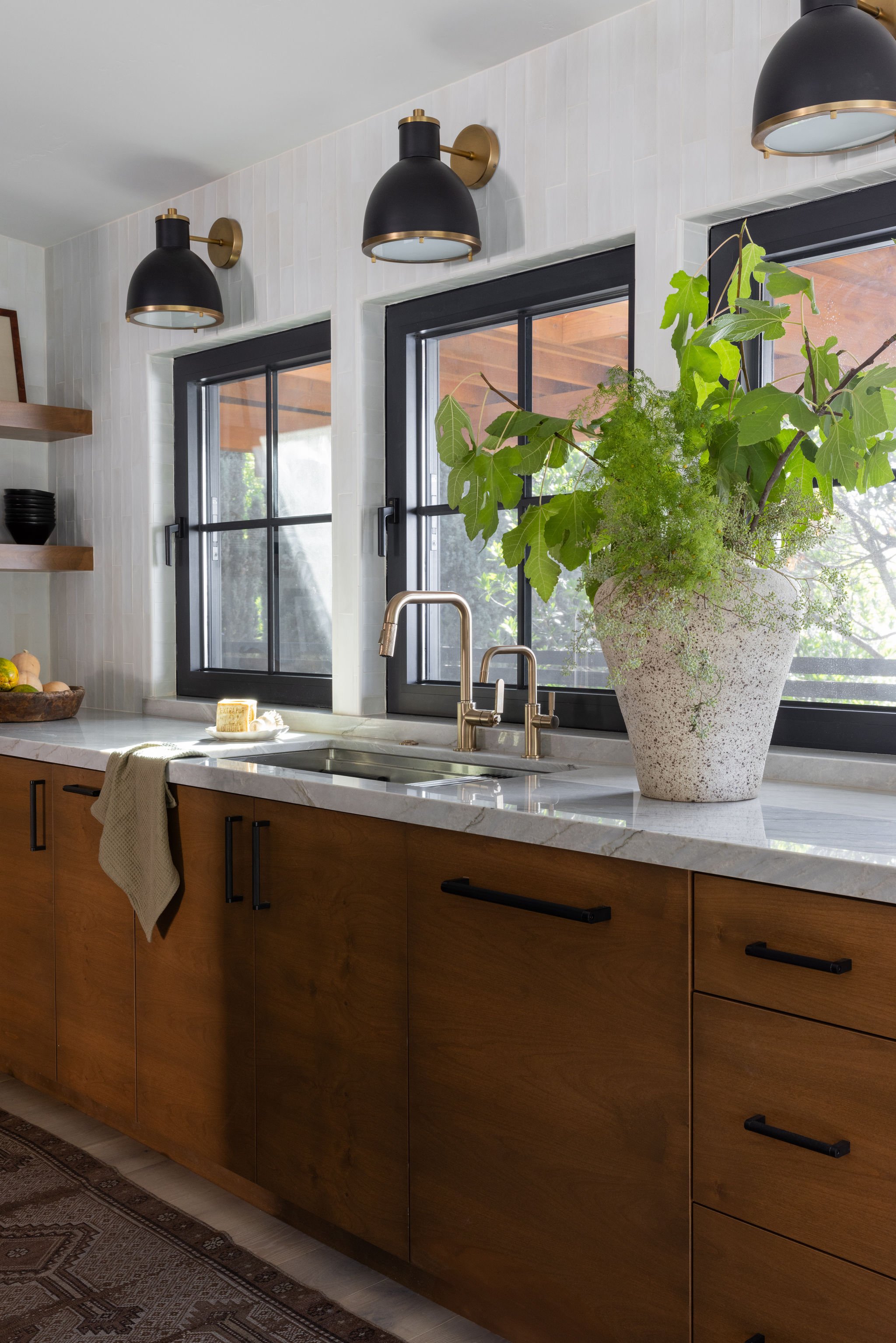 kitchen lighting windows sconces sink cabinets