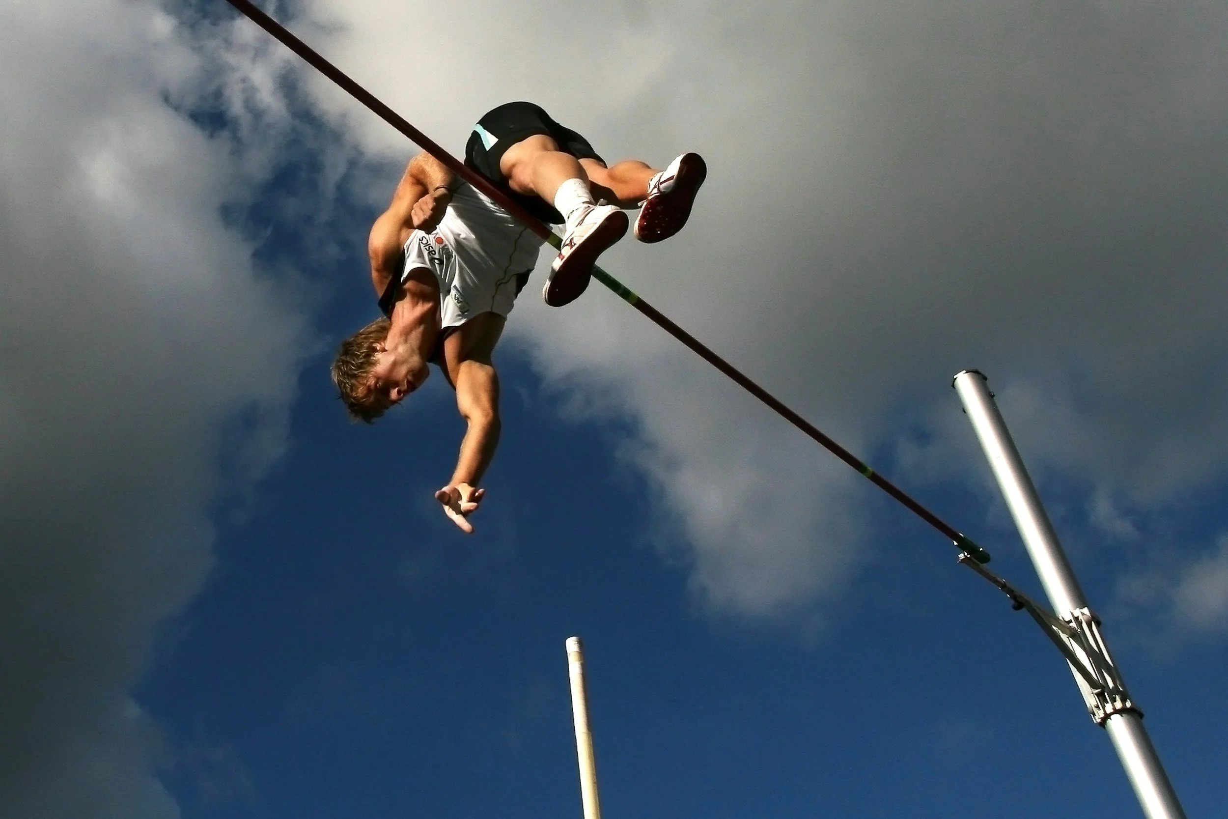 Track and field athlete pole vaulting