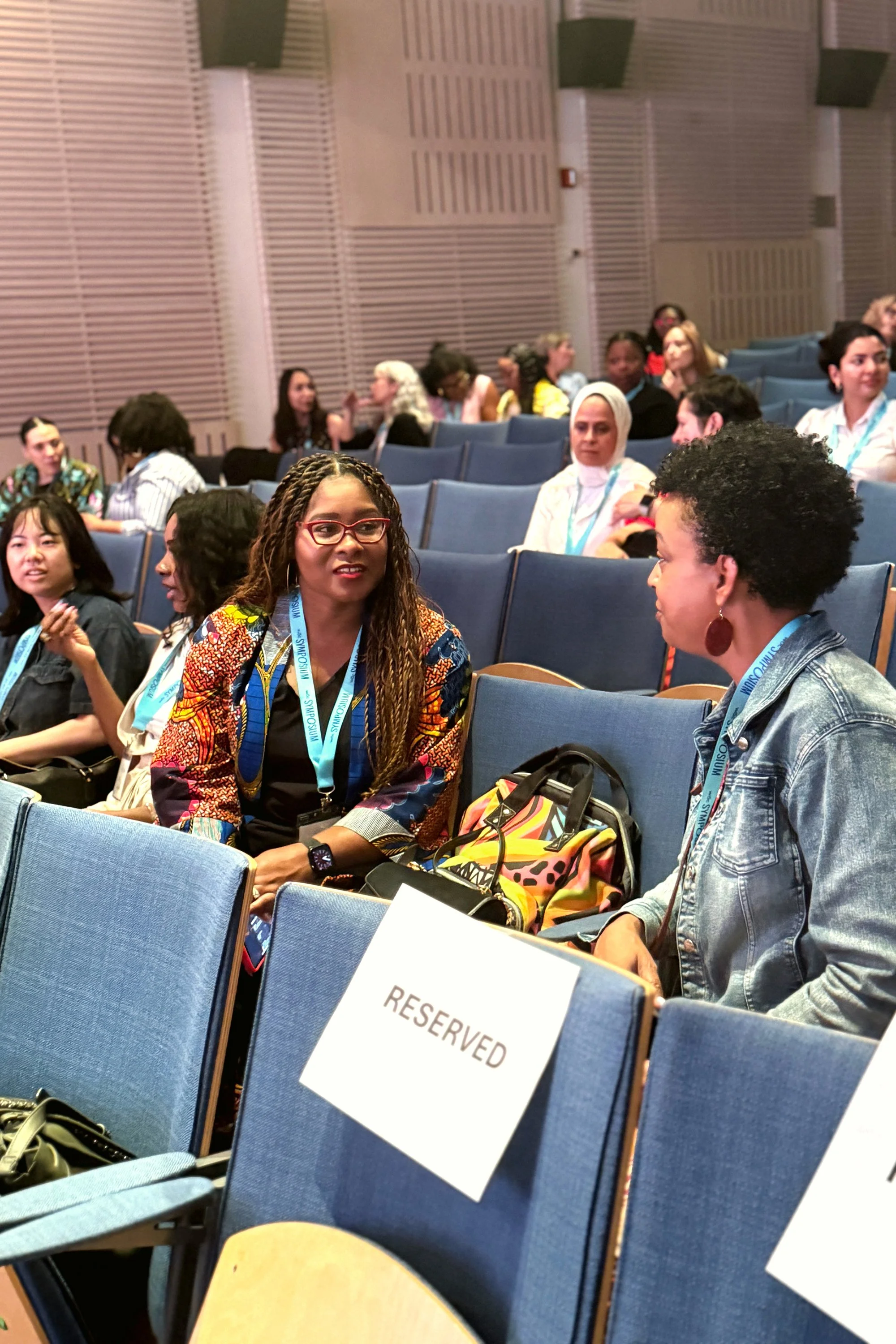 Seated attendees chatting
