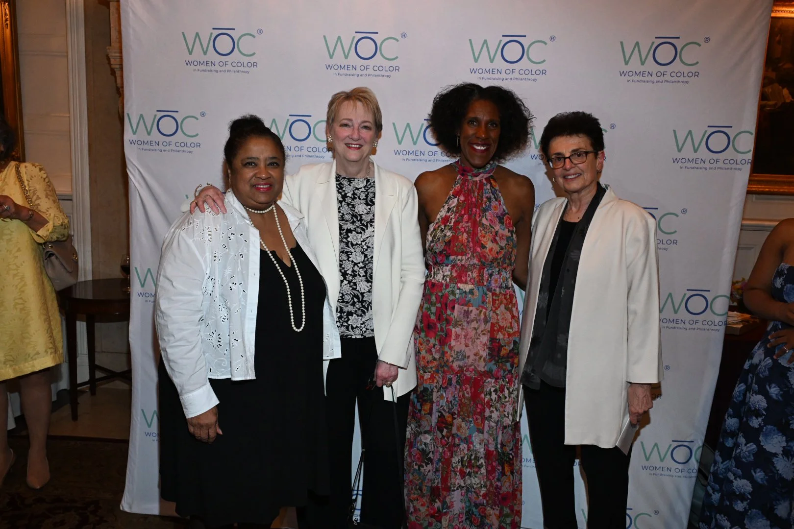 2026-woc-awards-give-them-their-flowers-honor-step-and-repeat.JPG