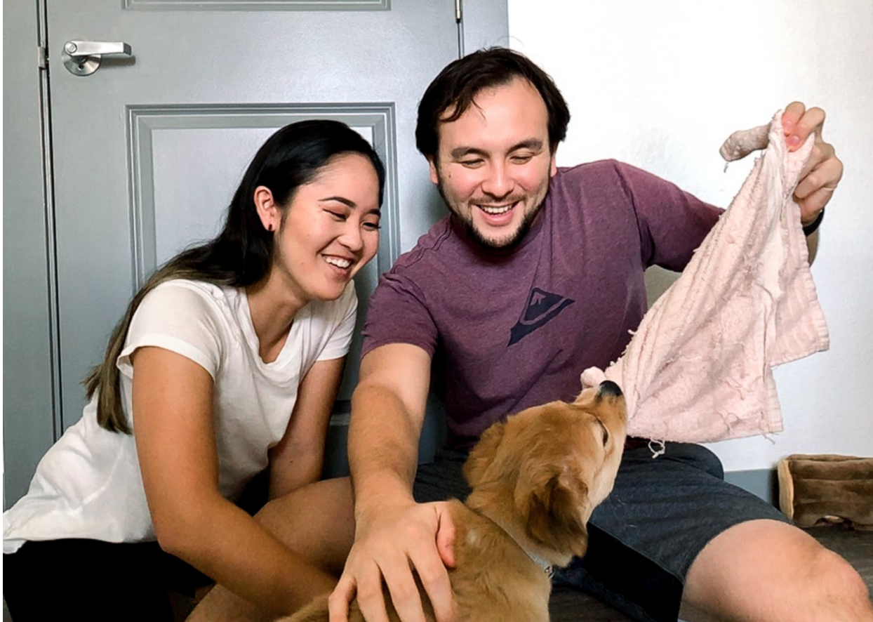 Kayla, Chris, and their dog Kina (pictured from left to right)