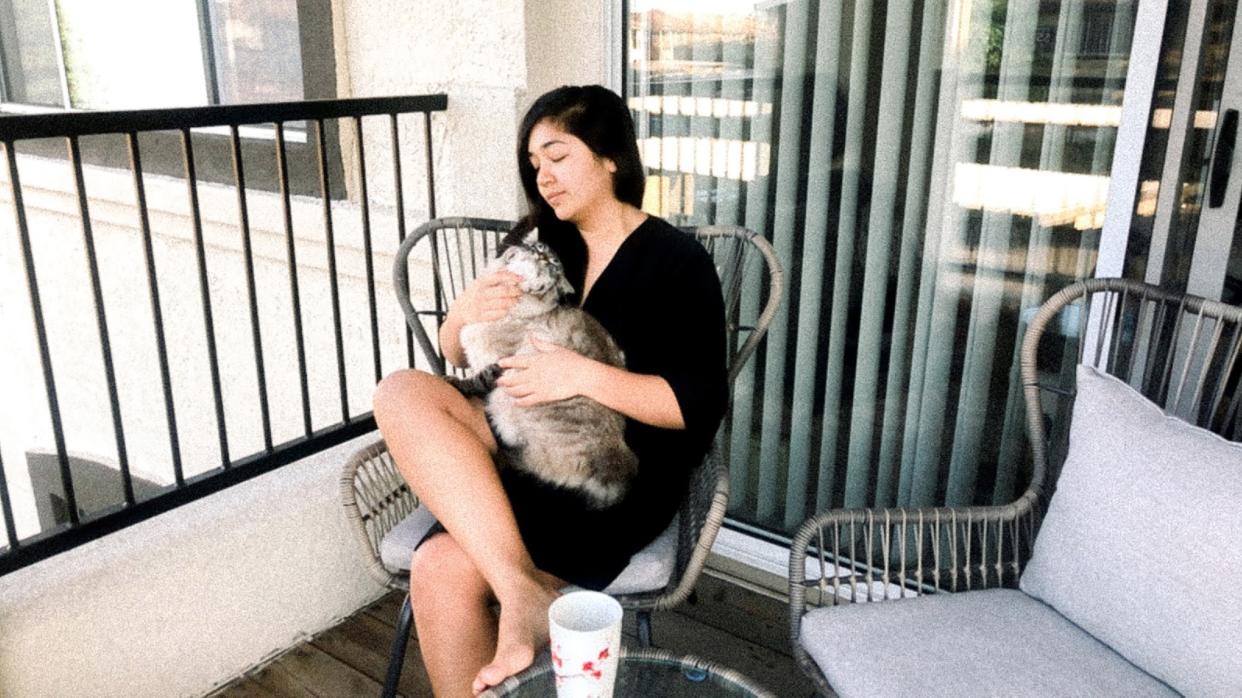 Katelyn on her front porch with her cat Vinny