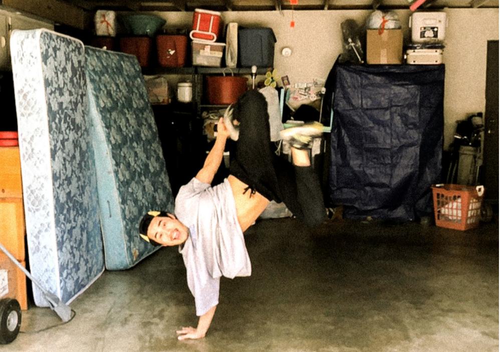 Jonathan break dancing in his favorite practice spot, his garage.