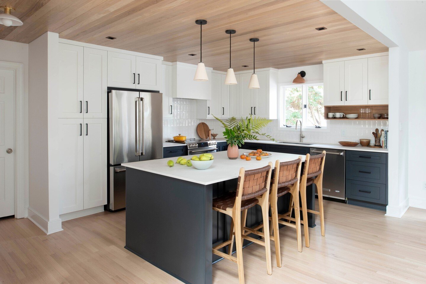 It's a new year and we have a new project to share! In this renovation of a 1980s home, we removed walls to open up the kitchen to the living and dining spaces. The kitchen was completely reimagined, floors were refinished, and we added a beautiful w