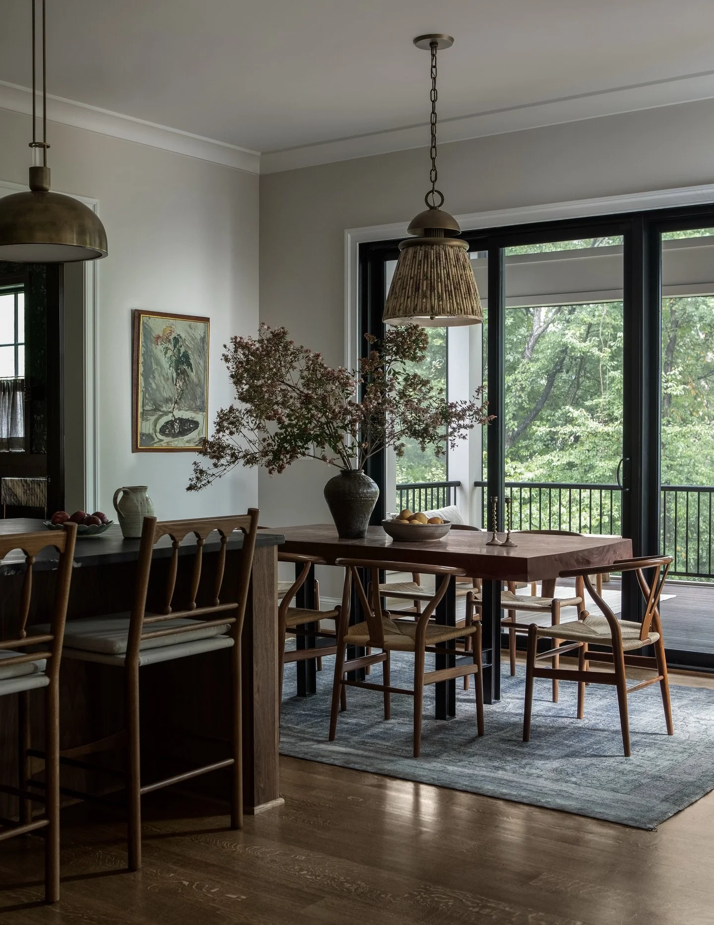 The Edison St house marked our third collaboration with these clients, and we reused some of their favorite pieces, including the dining table, chairs, and rug. We gave the dining nook a fresh new look by adding the pleated linen and brass light, and