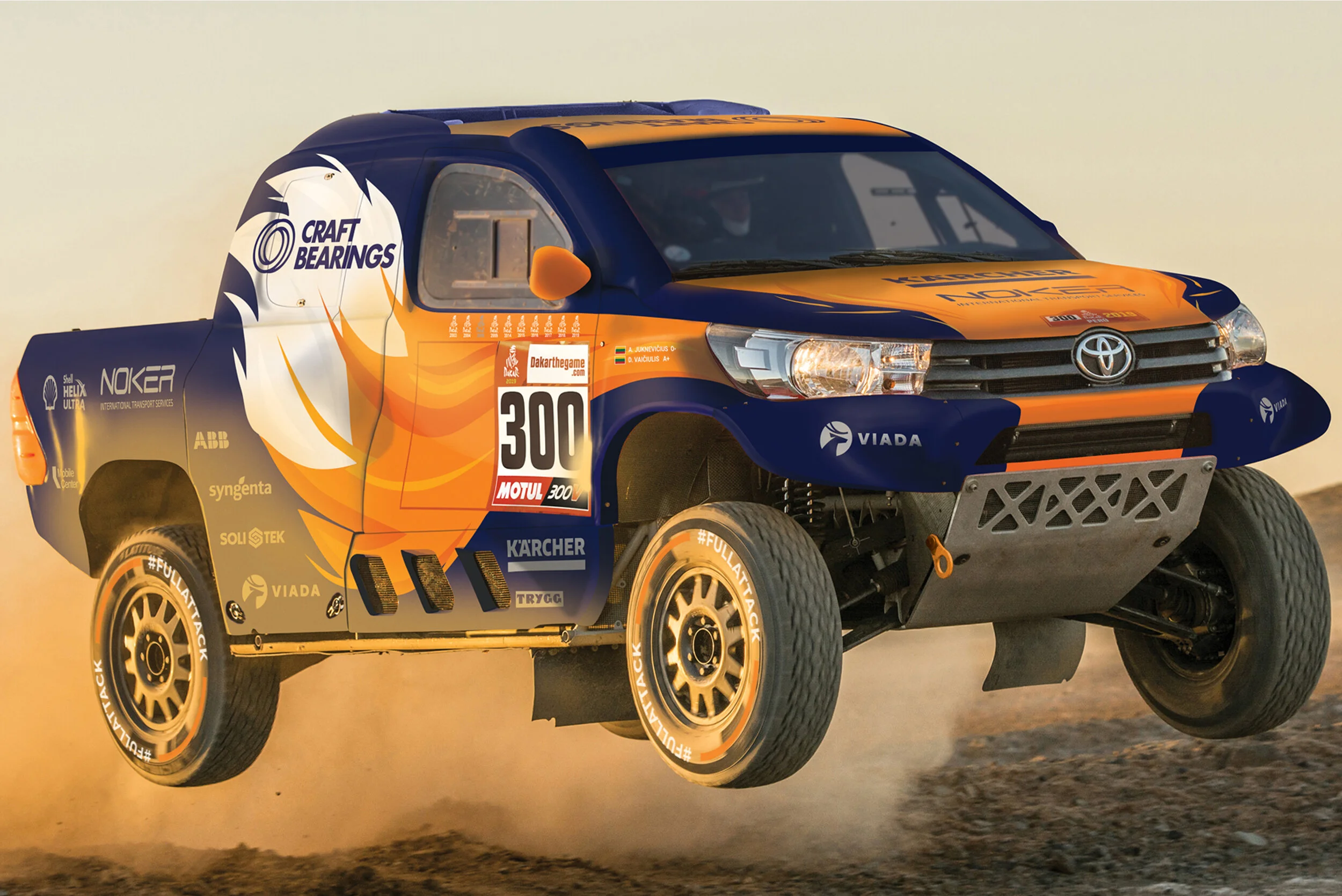 A rally truck flying through the air over a dirt road with dust behind it, featuring a blue and orange paint job with sponsor logos and the number 300.