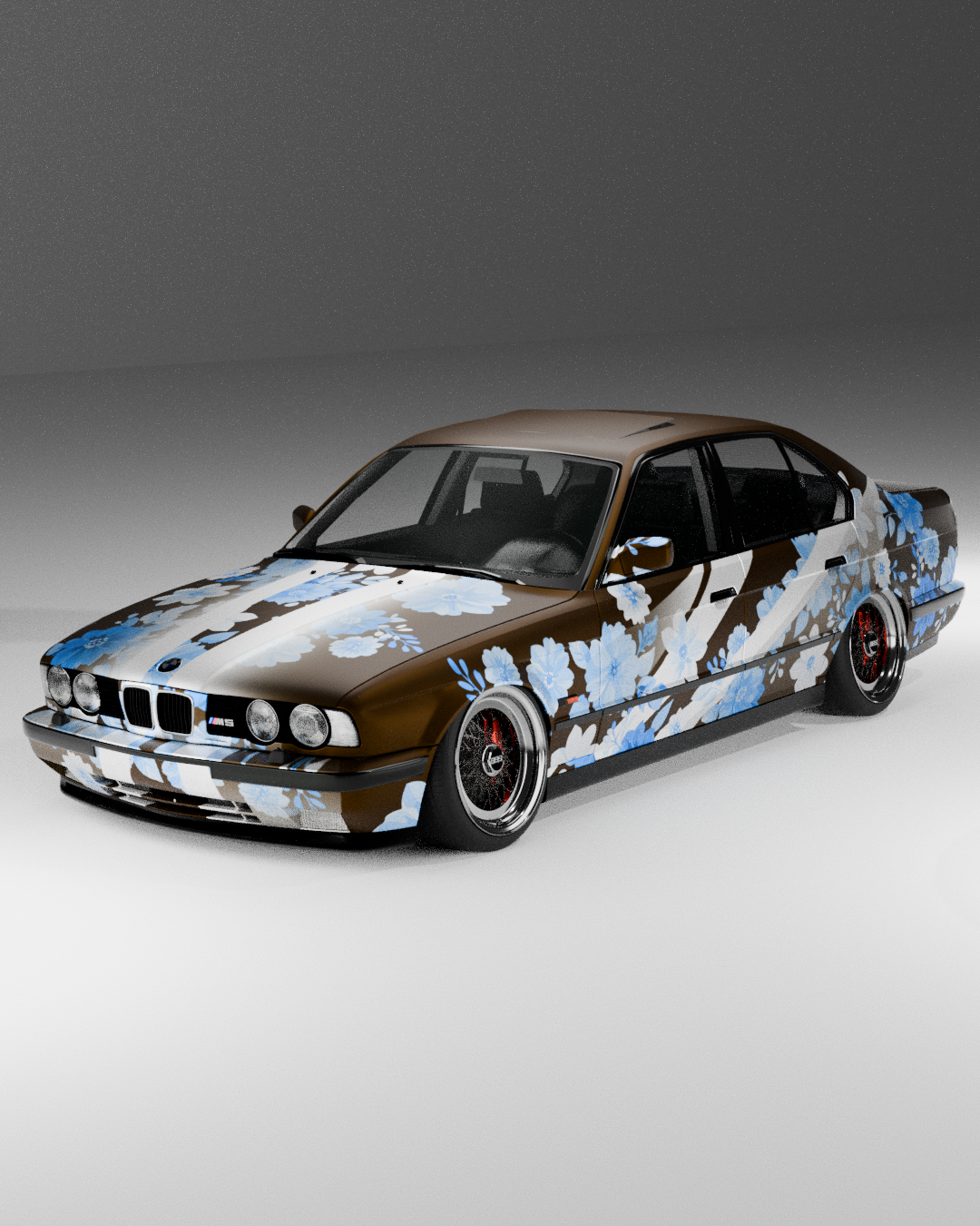 A BMW E28 M5 with a brown, white, and blue floral wrap design on a plain environment.