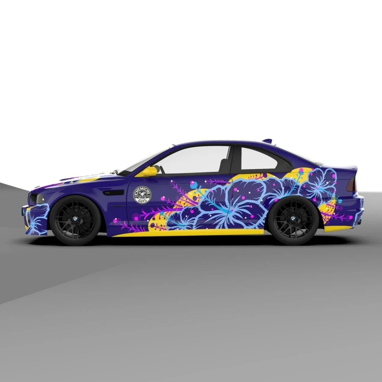 A blue race car with floral and abstract colorful designs, including flowers in purple, yellow, and pink, on the side.