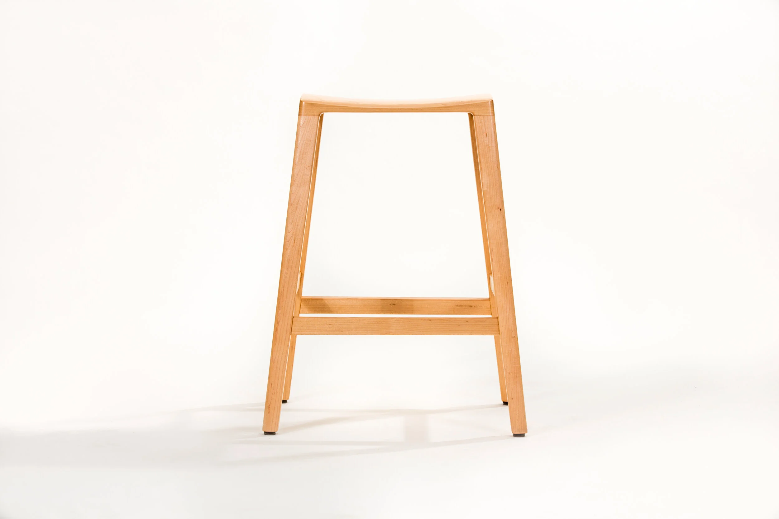 Radius wood Stool in custom wood furniture design featuring handmade bar stool with handcrafted structure in our furniture store