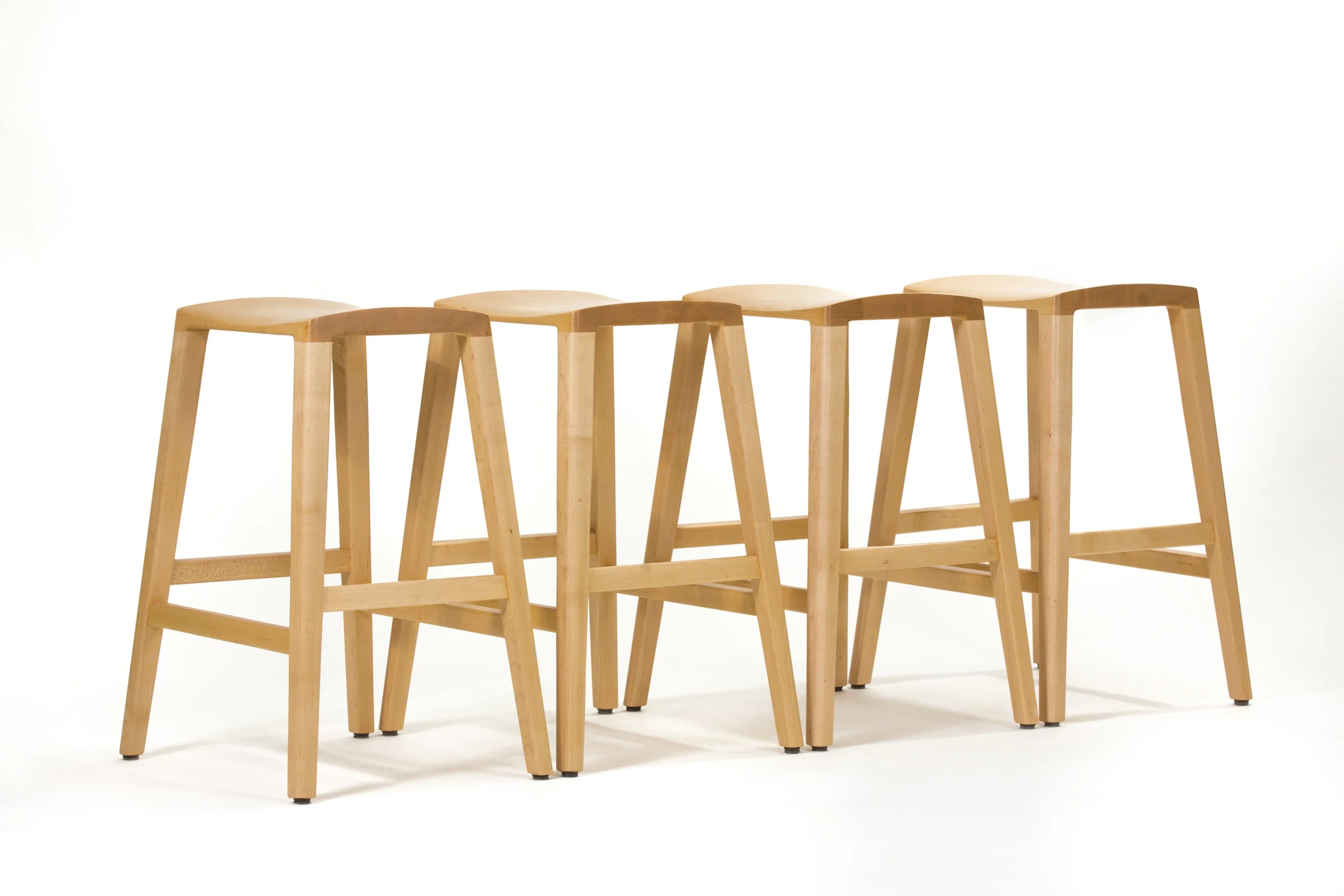 Handmade Radius wood Stool in custom wood furniture collection with minimalist design in our furniture store