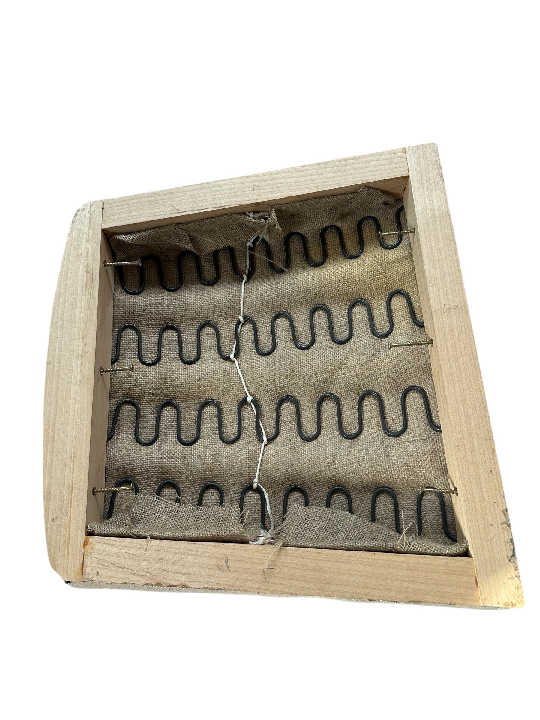 Upholstered seat rocker construction showing spring support in custom bespoke furniture design in online furniture shop