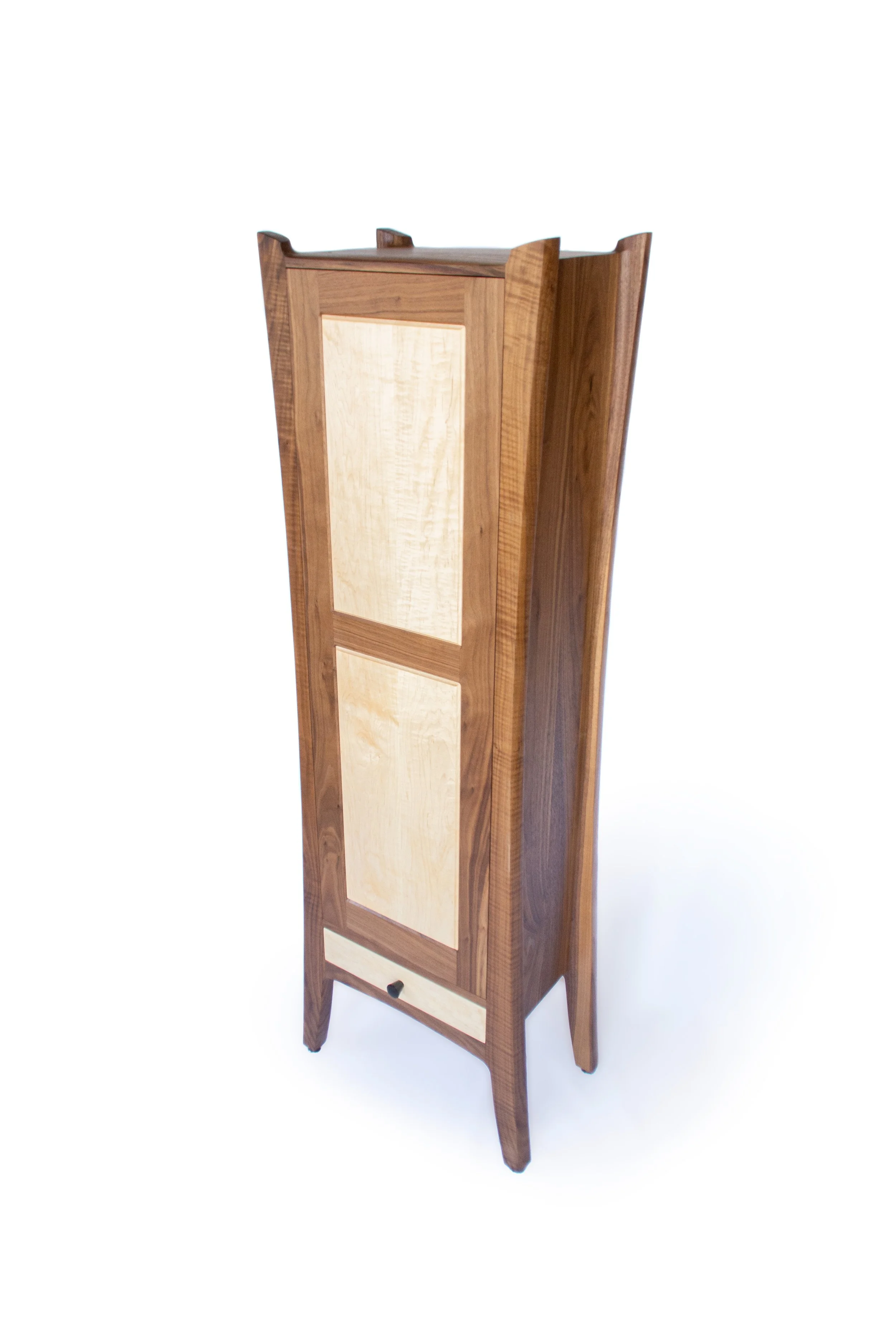 Custom furniture cabinet featuring handcrafted design with light wood panels.