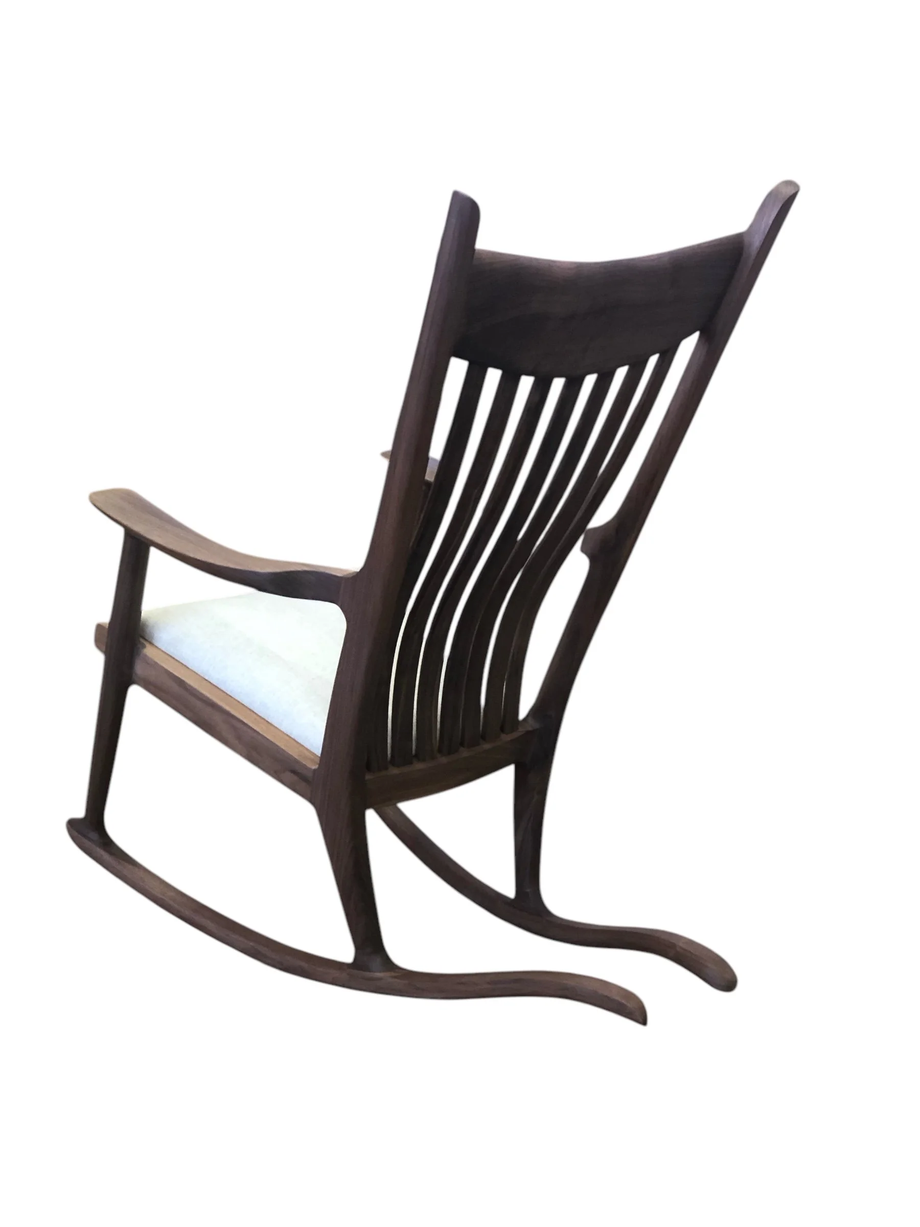 Handcrafted custom wood bespoke furniture upholstered seat rocker chair showing curved rocking structure in online furniture store