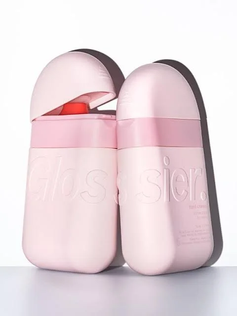 A packaging example of the Glossier brand which is a pale pink, lighter than millennial pink.