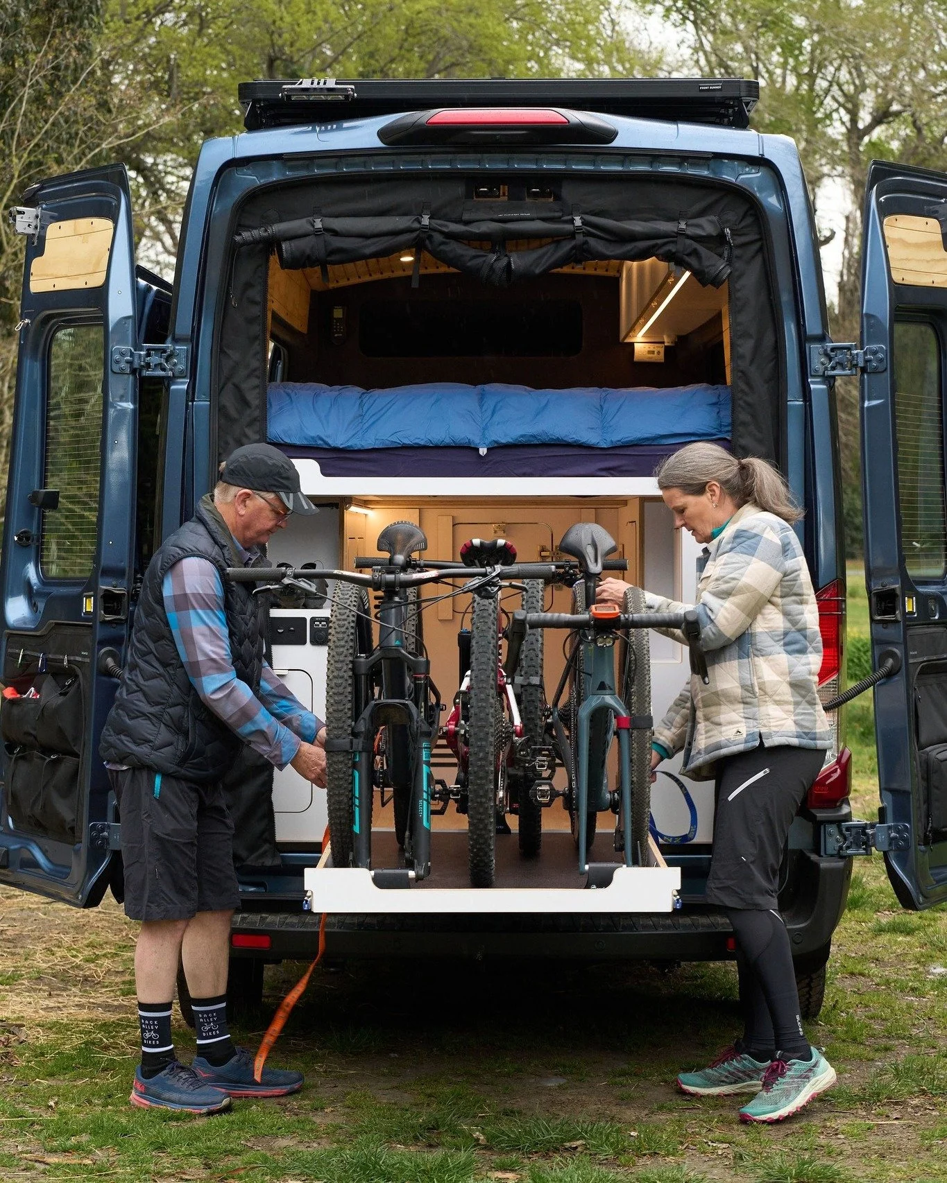 For Trevor and Carmen, the bikes come first. Every part of their van&rsquo;s garage was designed with cycling in mind&mdash;including custom cabinetry and handlebar cutouts so all three bikes fit safely and snugly inside.

Smart design means they can