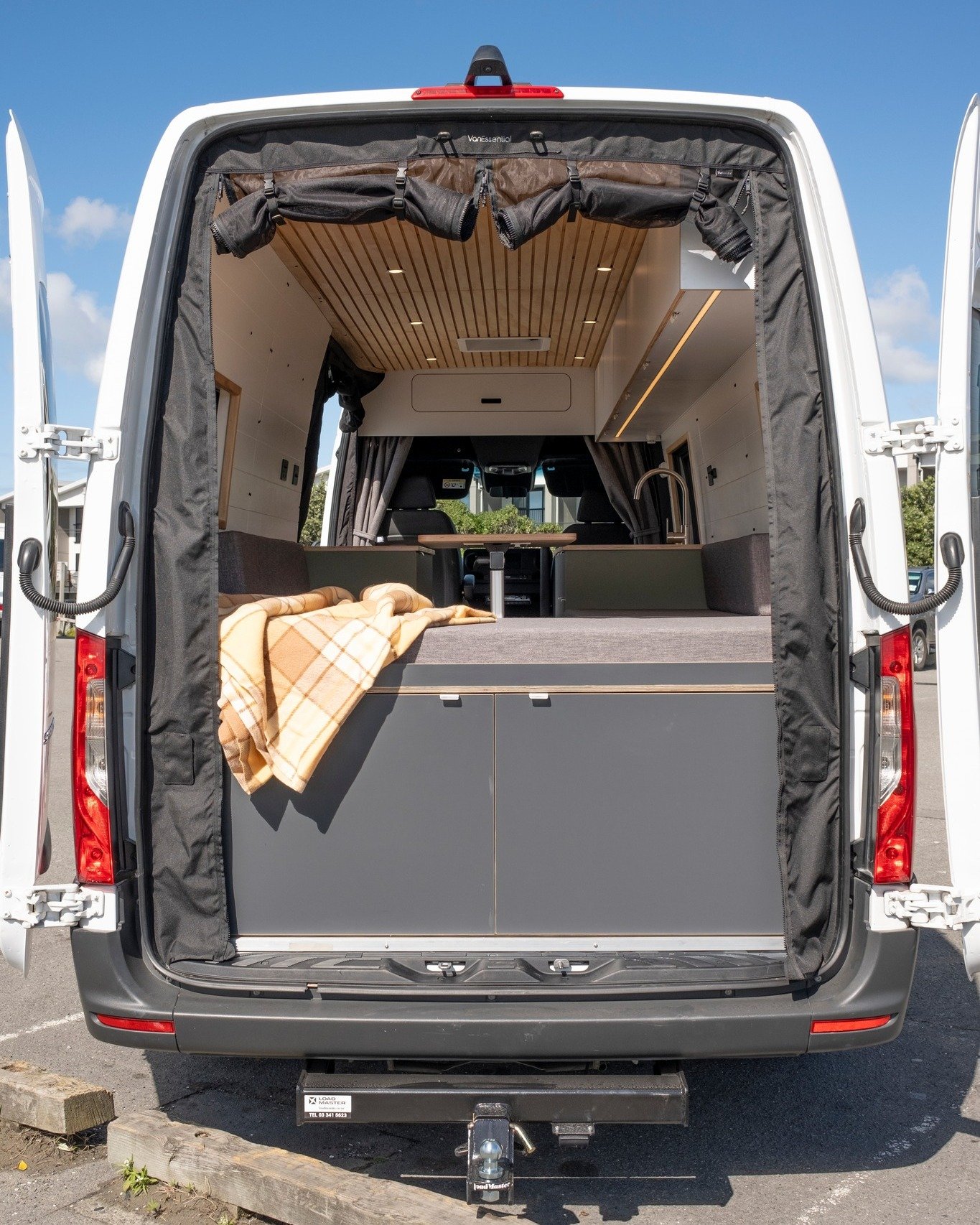 When Michael and Julia imagined their dream camper, they wanted space. More room to move, relax, cook, work, and lounge with their dog after a long surf. That desire shaped the interior from day one.

We added extra windows to keep the space from fee